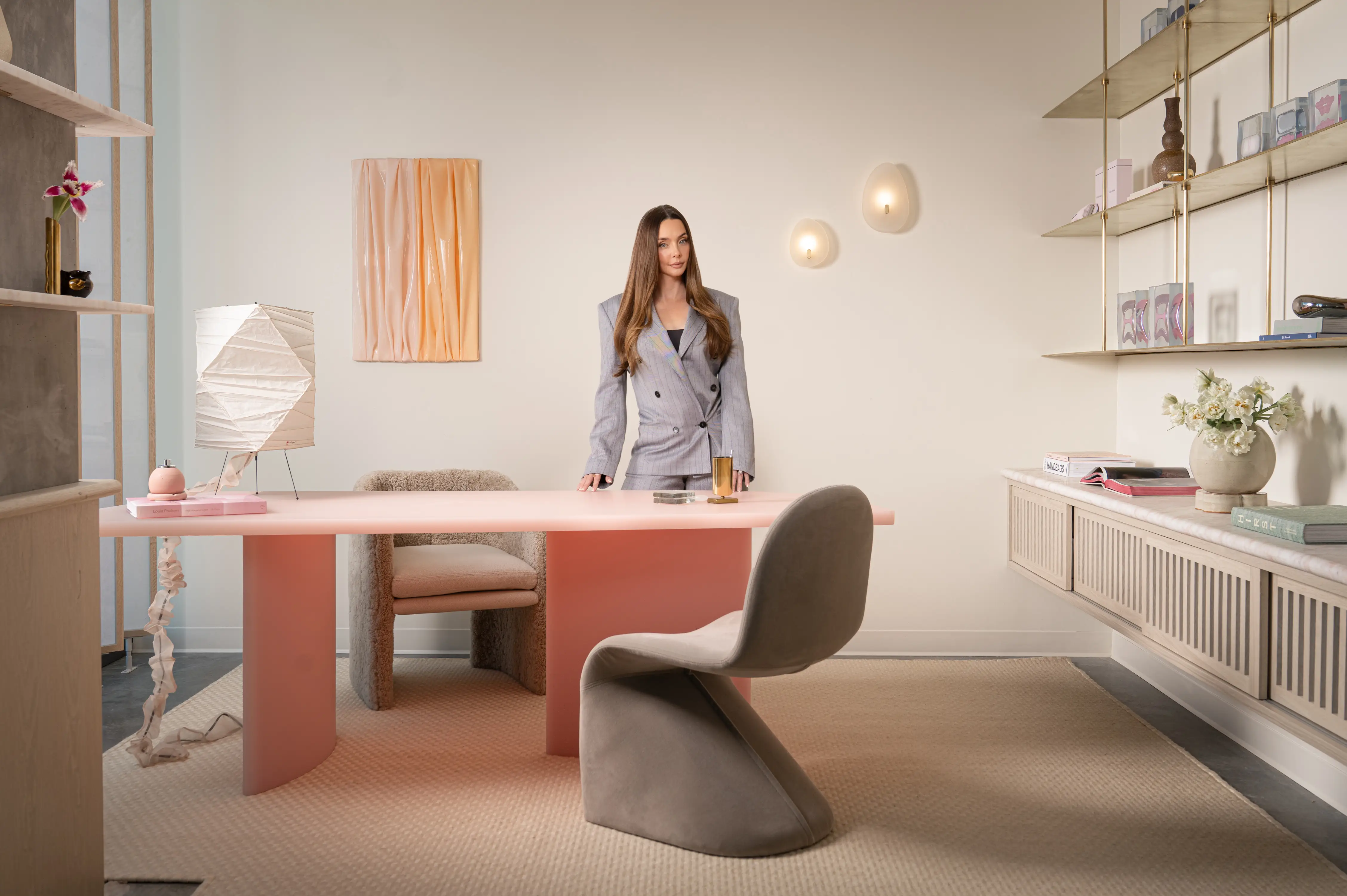 Lauryn Bosstick stands behind a desk