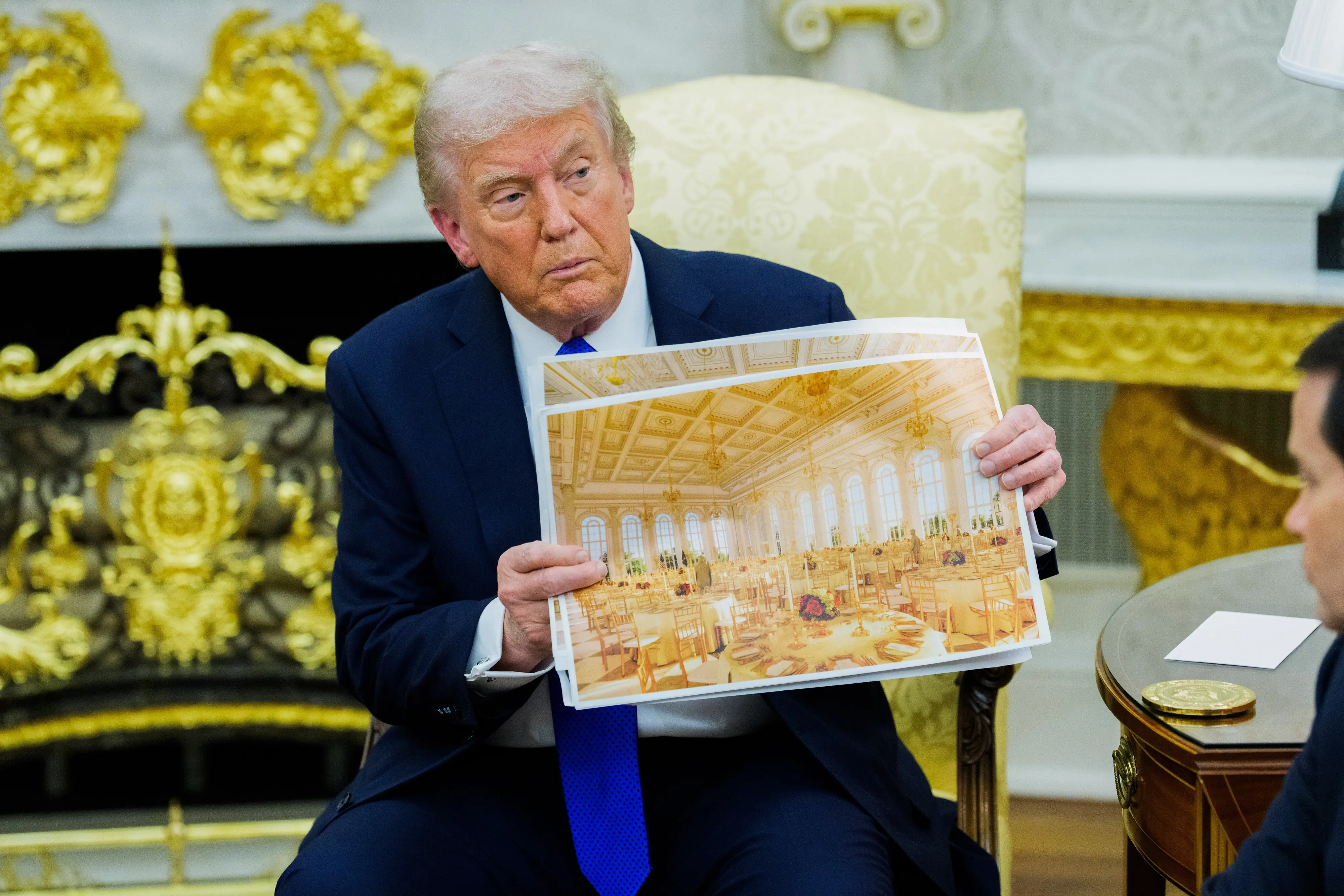 Trump holding a rendering of the planned White House ballroom.