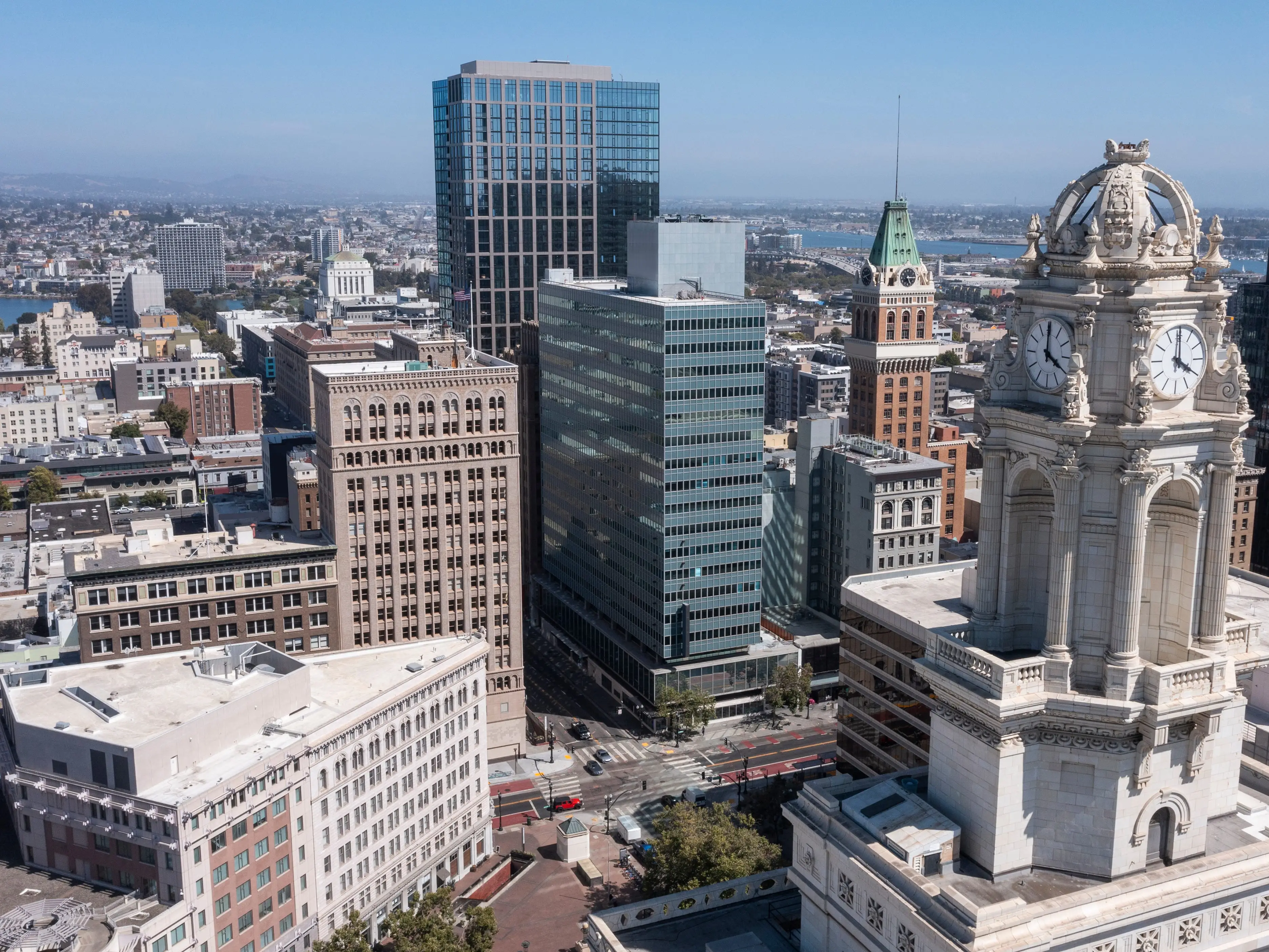 Afternoon skyline aerial view of the urban core of downtown Oakland, California, USA.