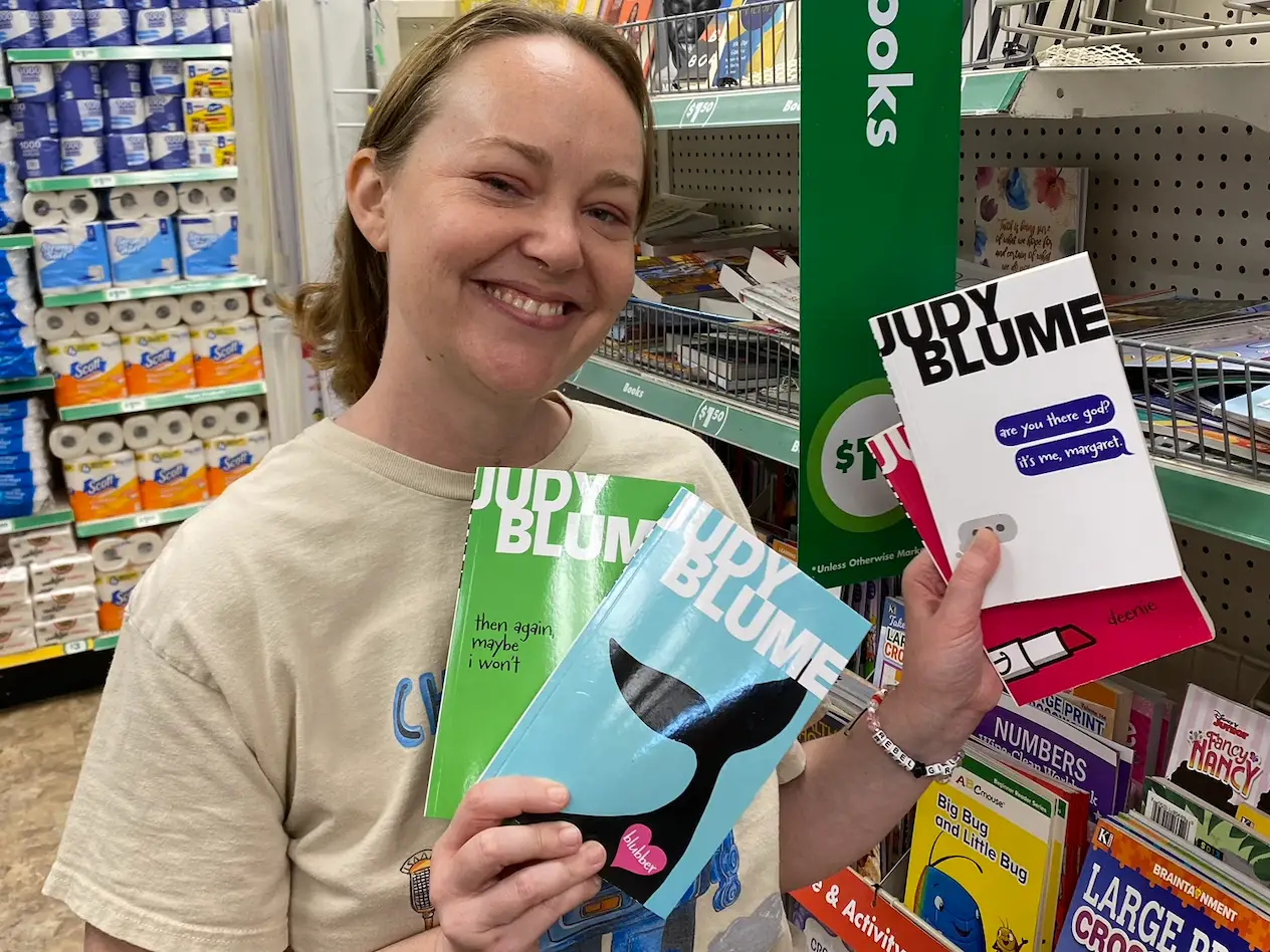 Woman holding school supplies