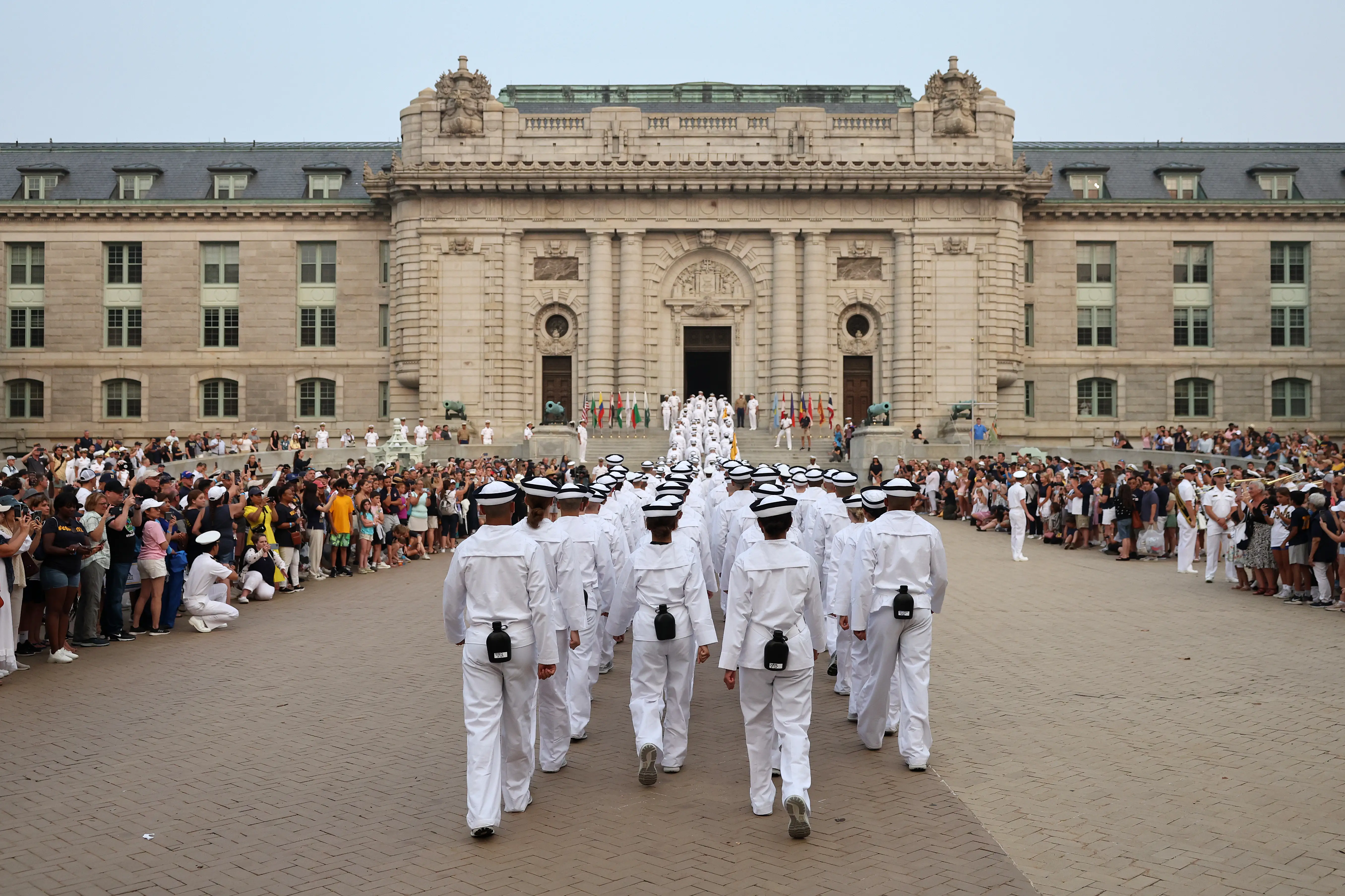 Incoming plebes march into Bancroft Hall.