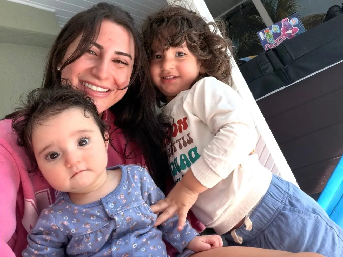 Woman smiling with two children