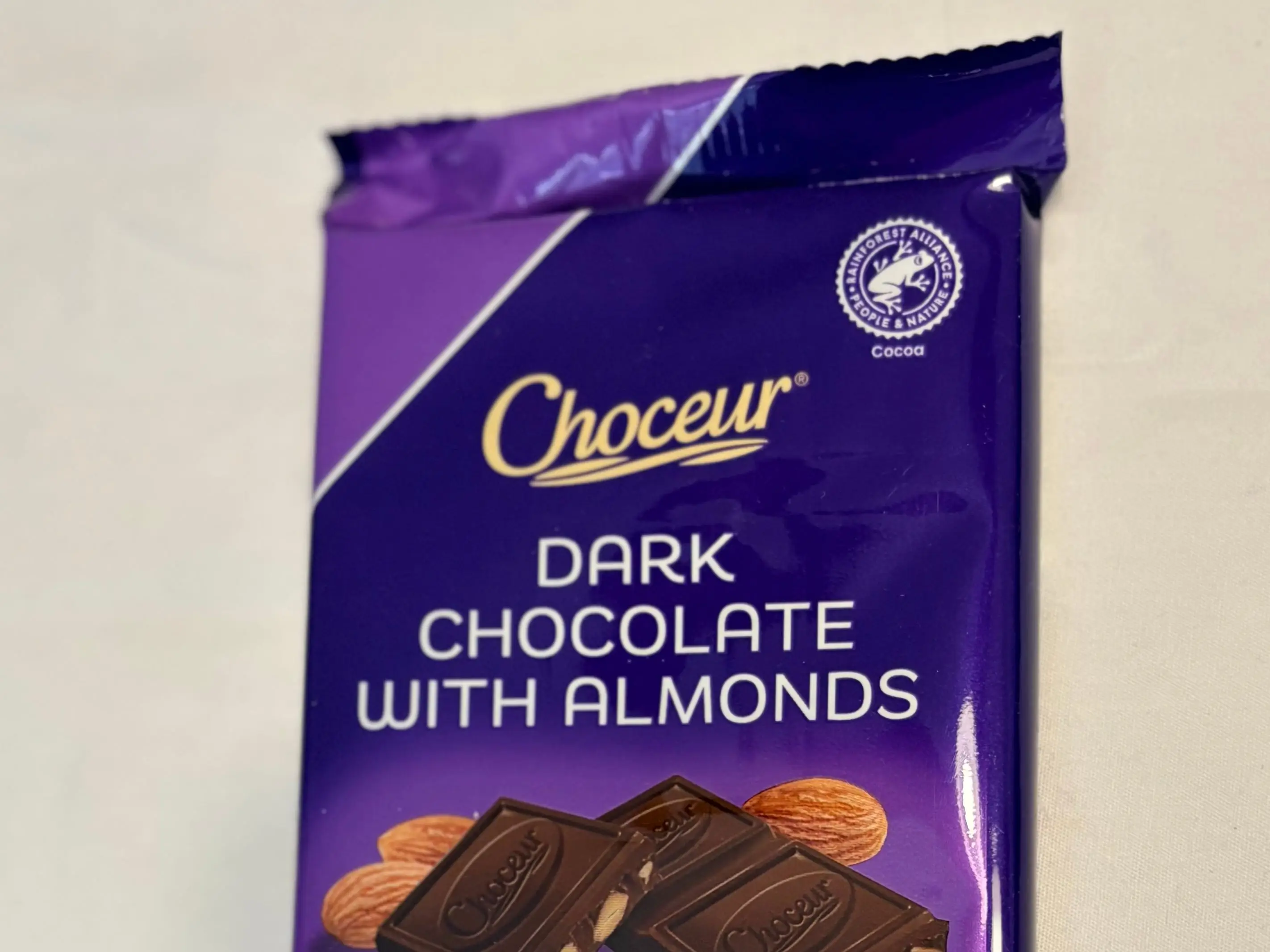 A Choceur dark-chocolate almond bar sits on a table.
