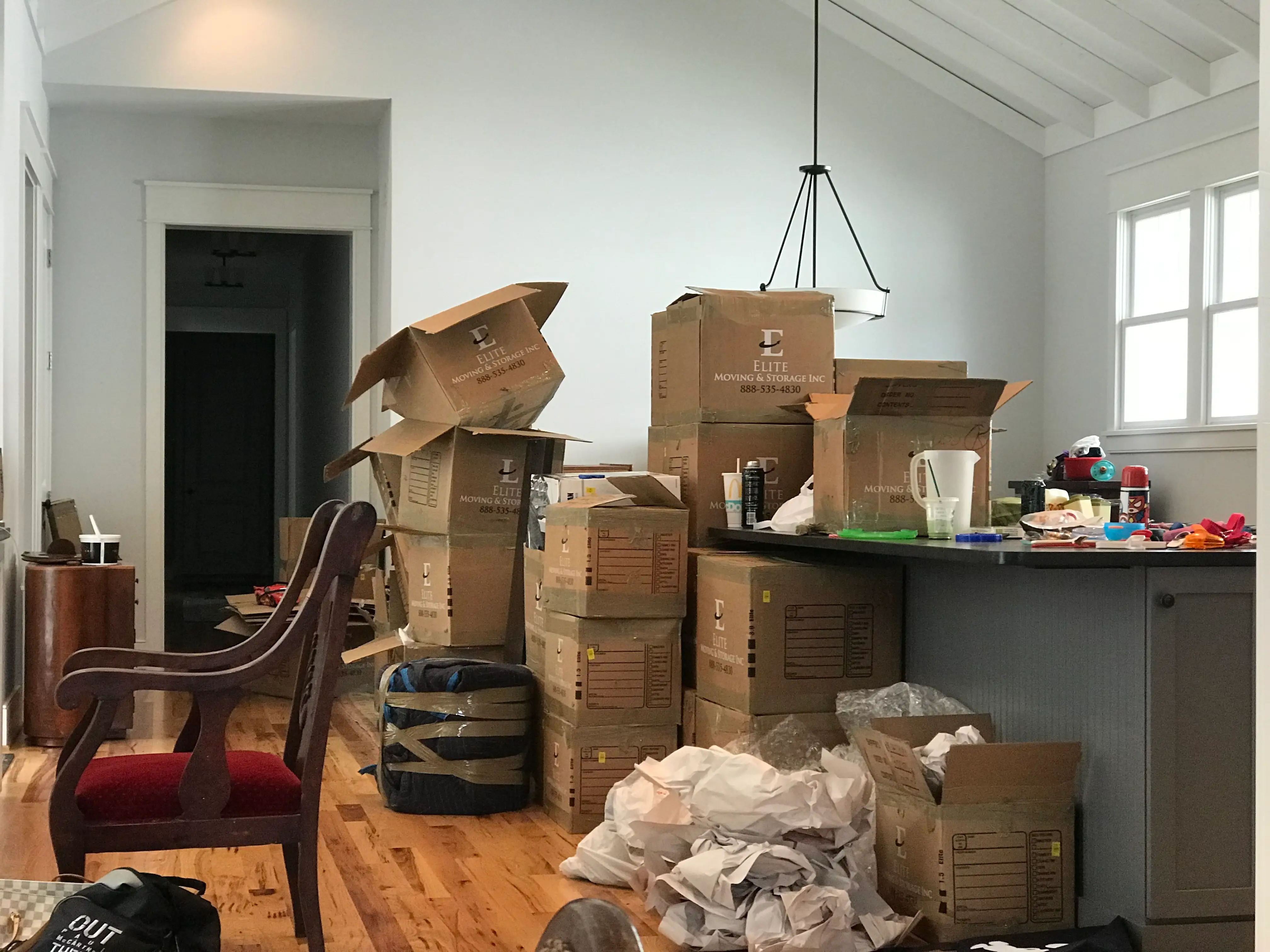 the author's home filled with moving boxes
