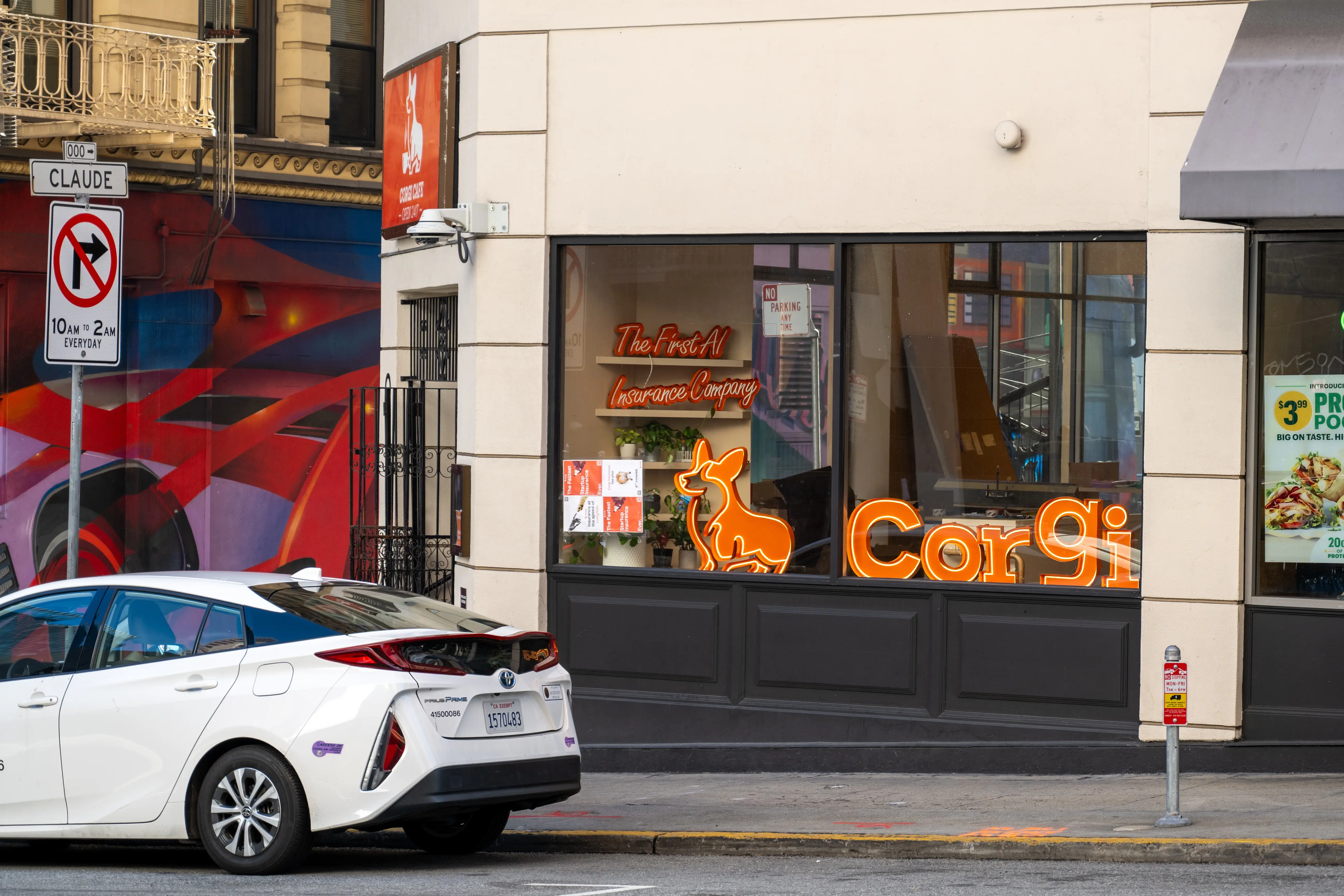 Street-level view of a Corgi storefront with neon signage and a white Toyota Prius parked outside.