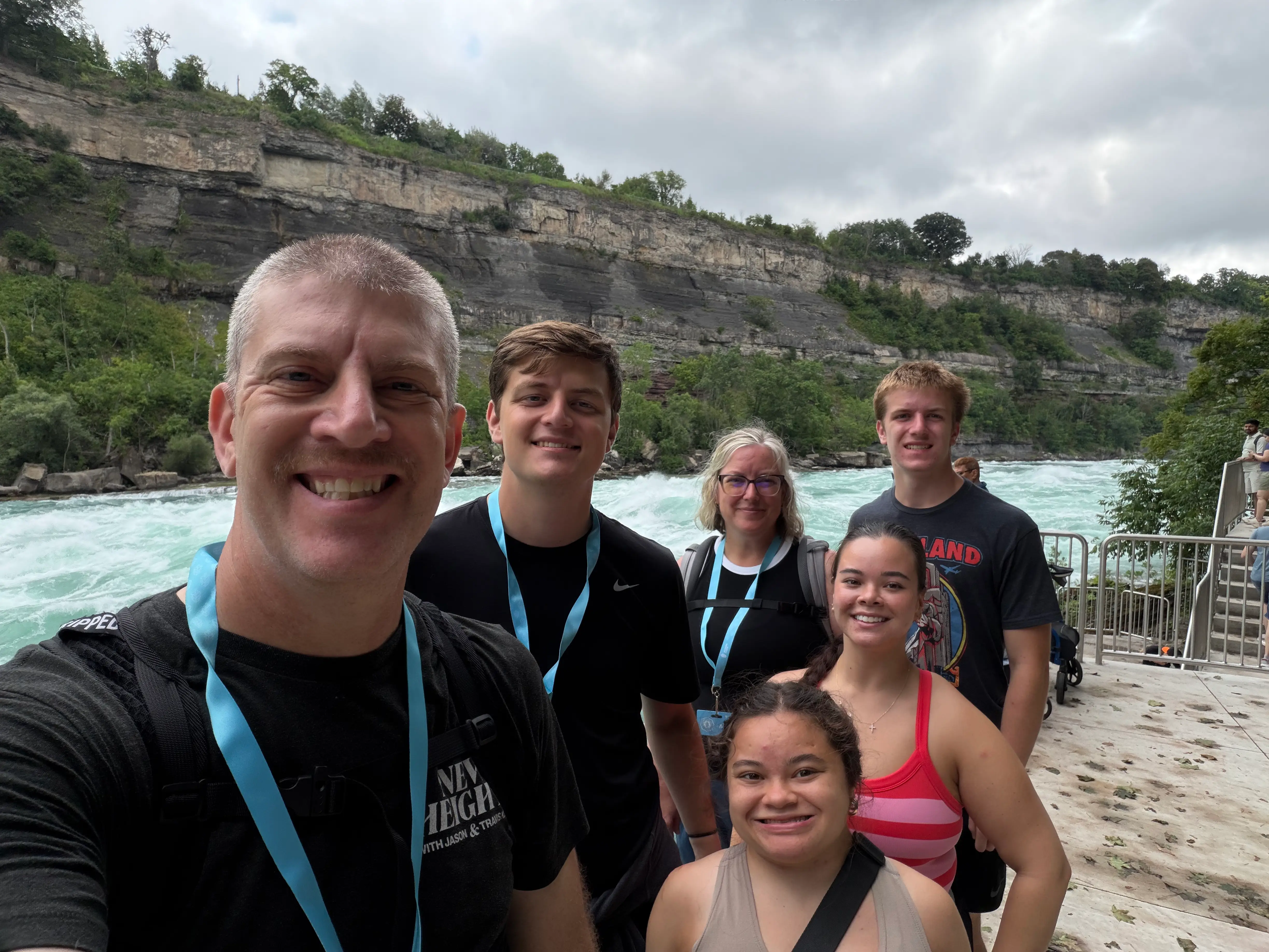 The writer, his kids, and his wife taking a selfie at Niagara Falls.