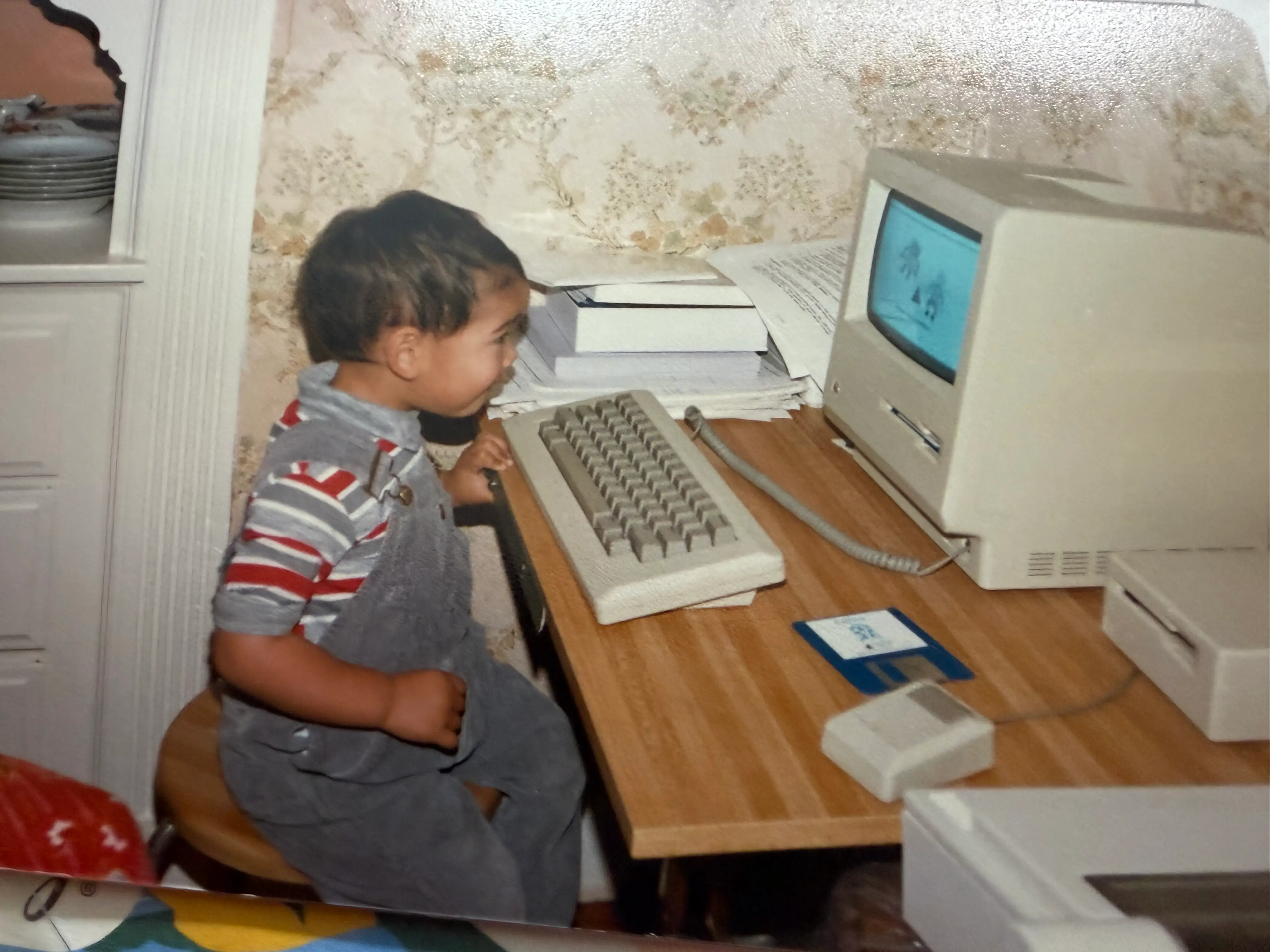Old photo of kid on a computer