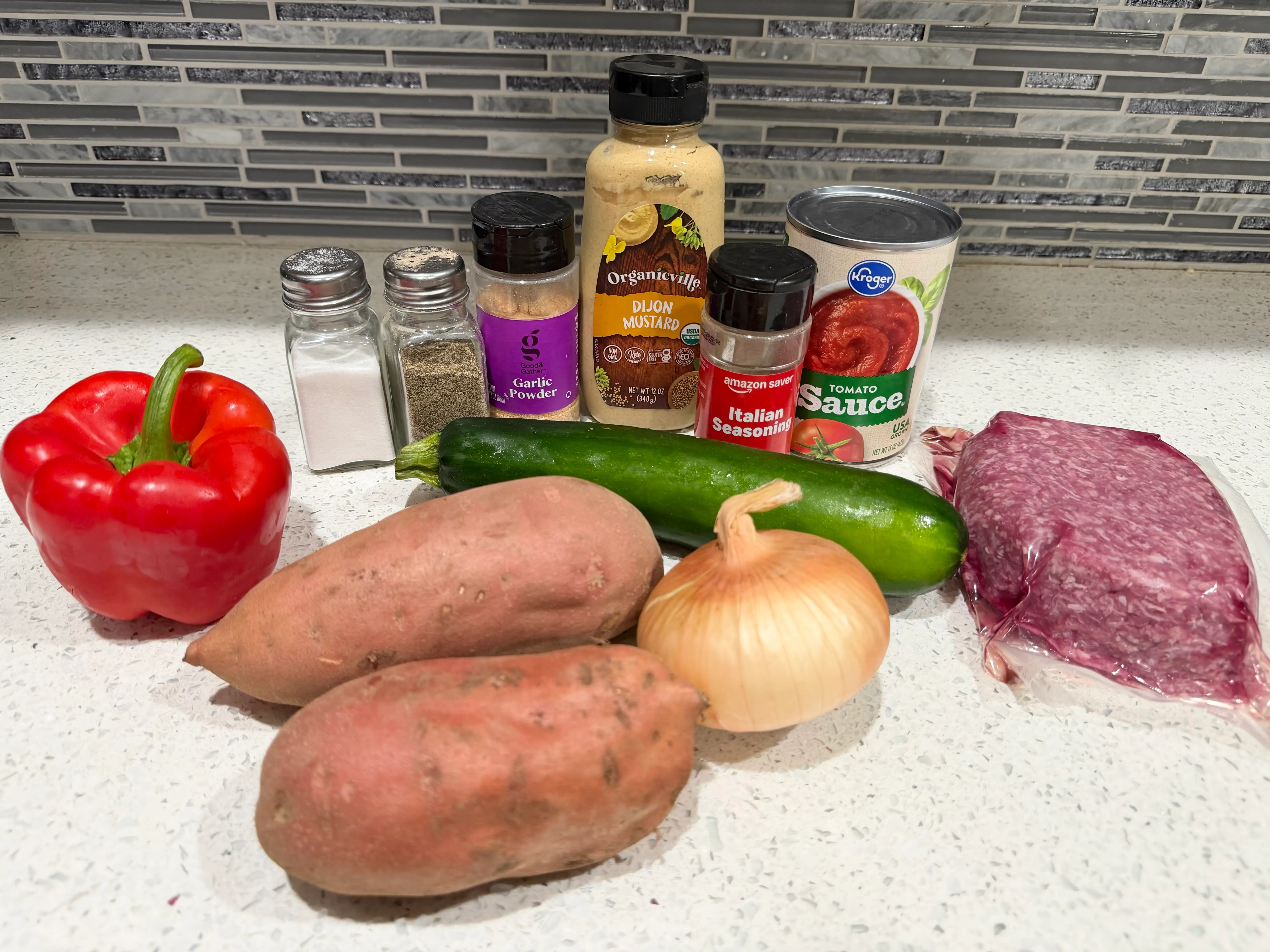 Produce, cans and other ingredients lined up on counter