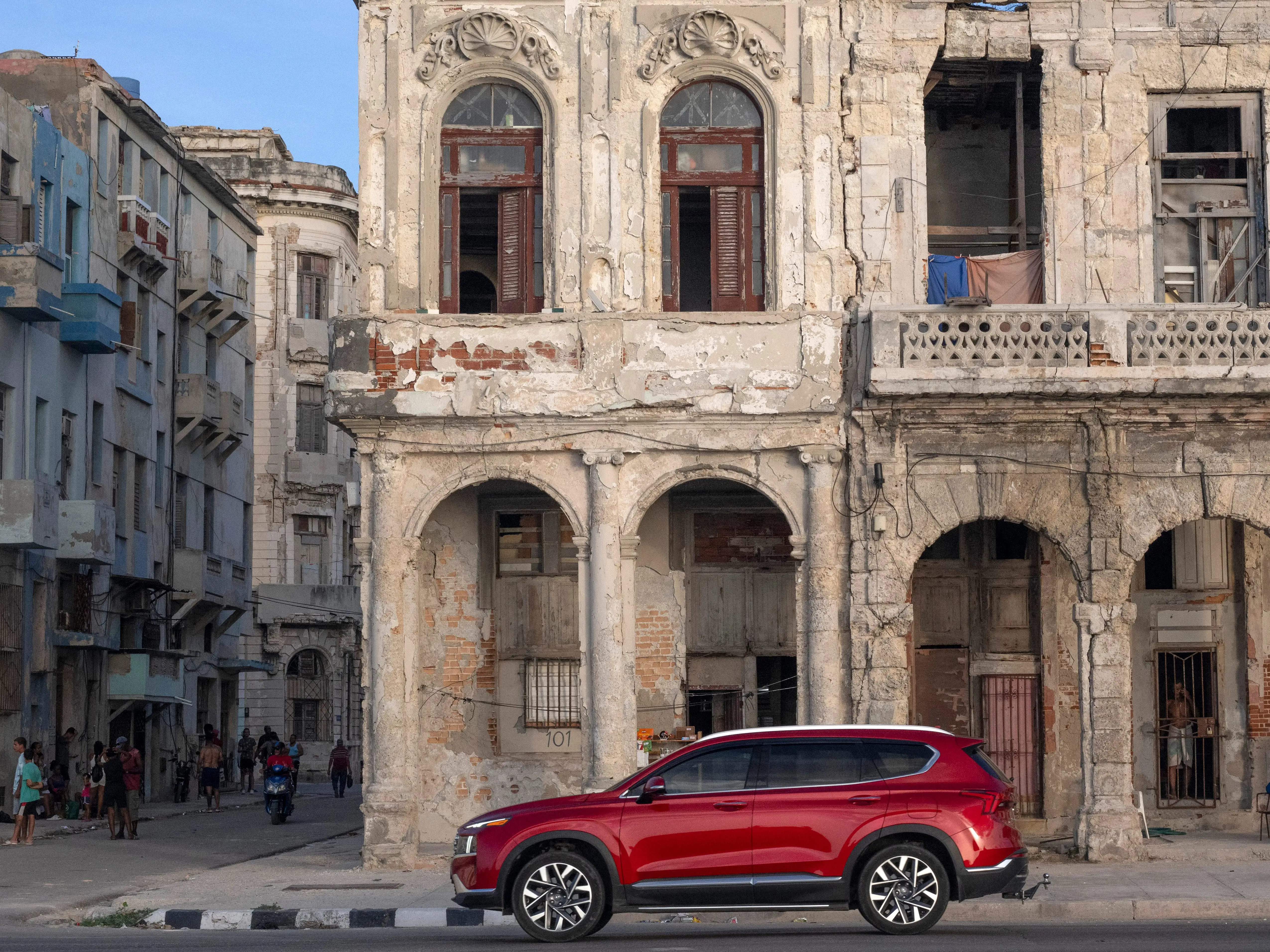 A car passes in front of an old house along the Malecon in Havana on June 16, 2026.
