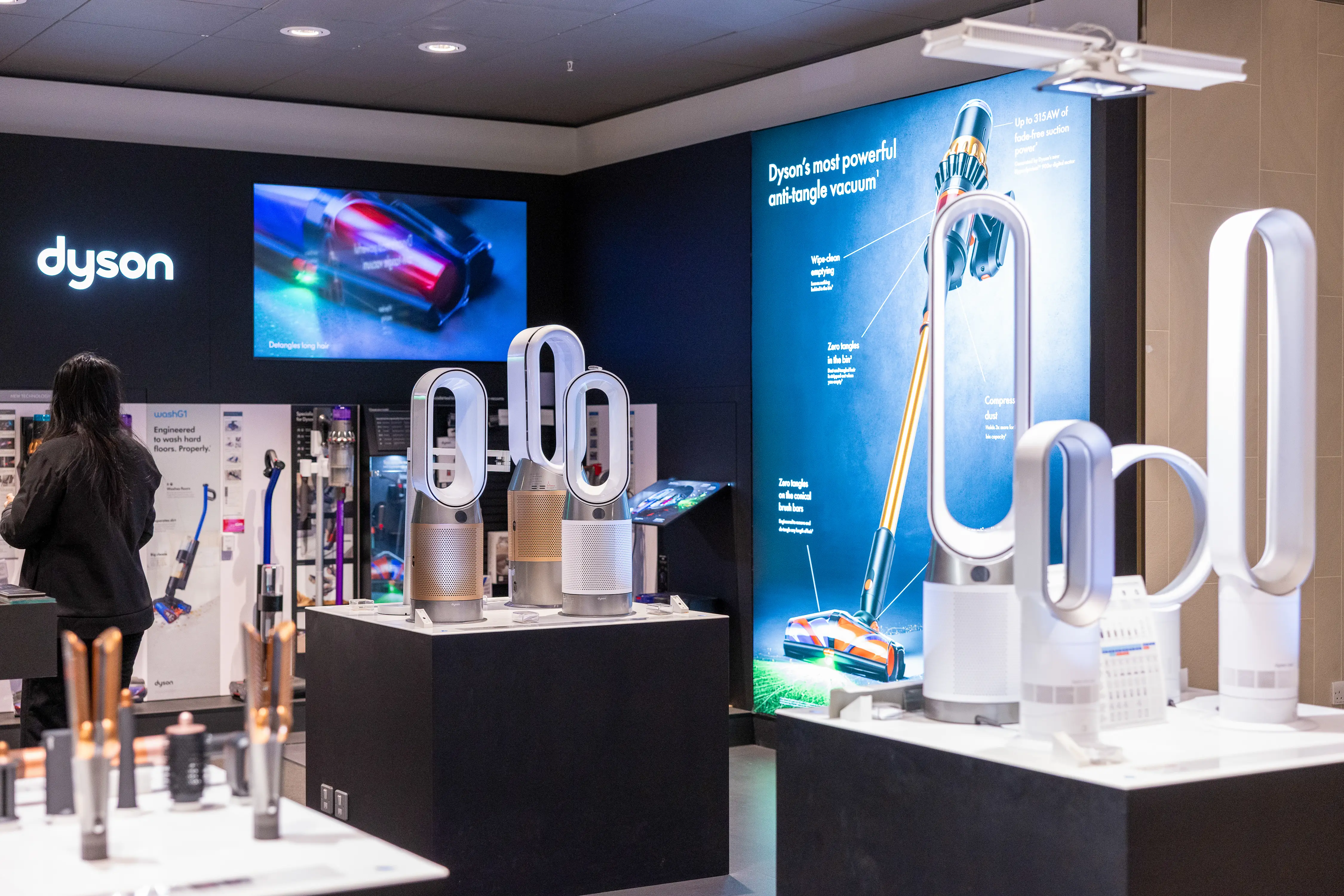 The inside of a Dyson store. There are two displays of its fans and air purifiers.