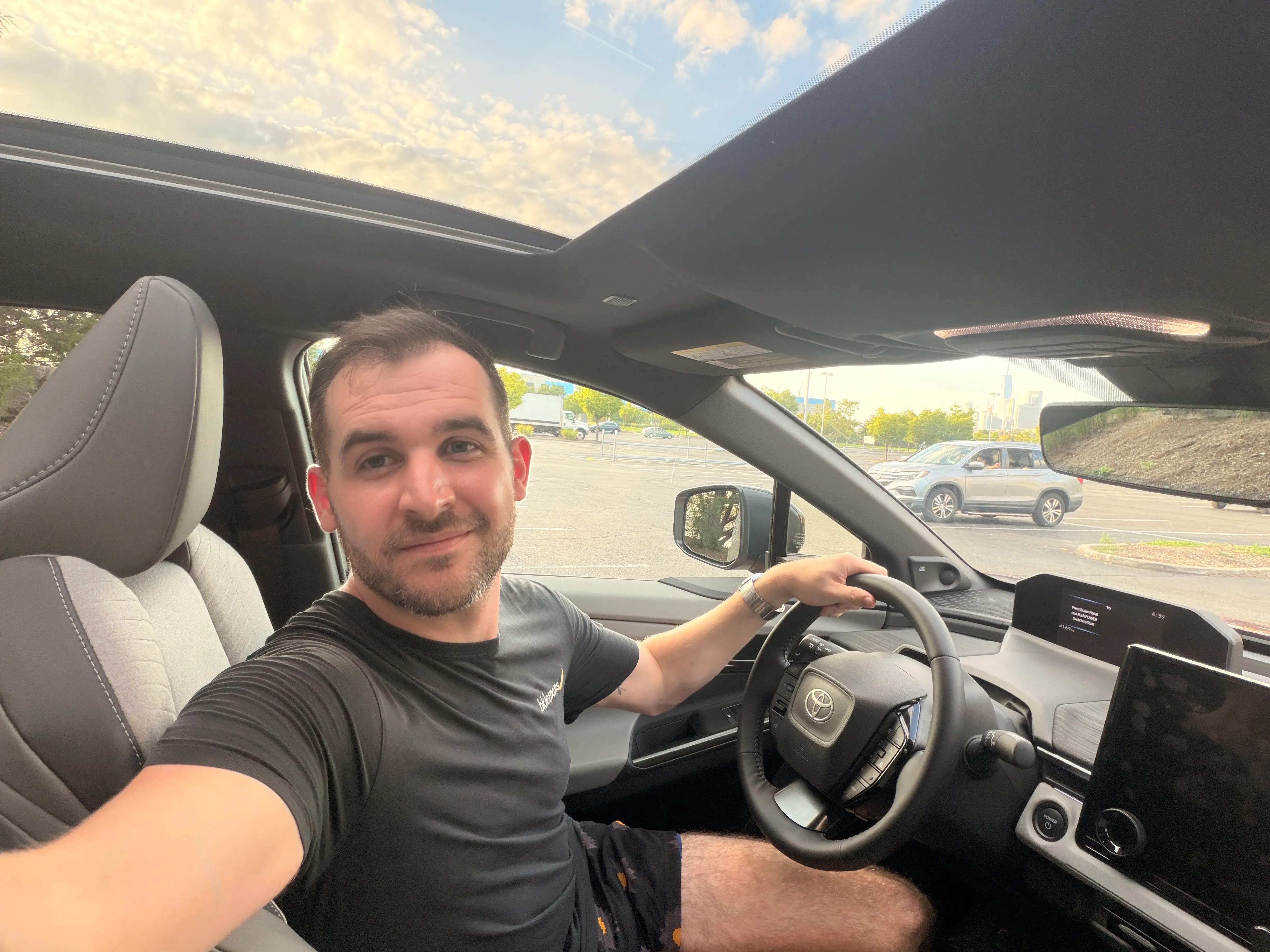 Business Insider's autos reporter, Ben Shimkus, sits in the driver's seat of a Toyota C-HR.