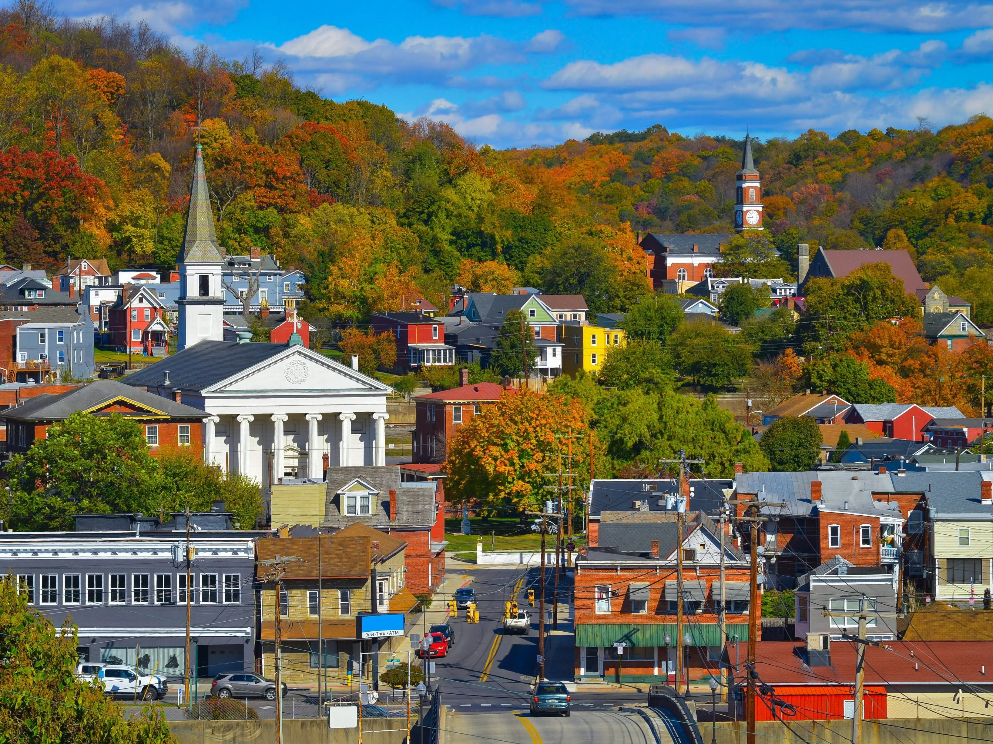 Picturesque mountain town of Cumberland Maryland on a beautiful autumn day with vibrant fall colors and puffy clouds