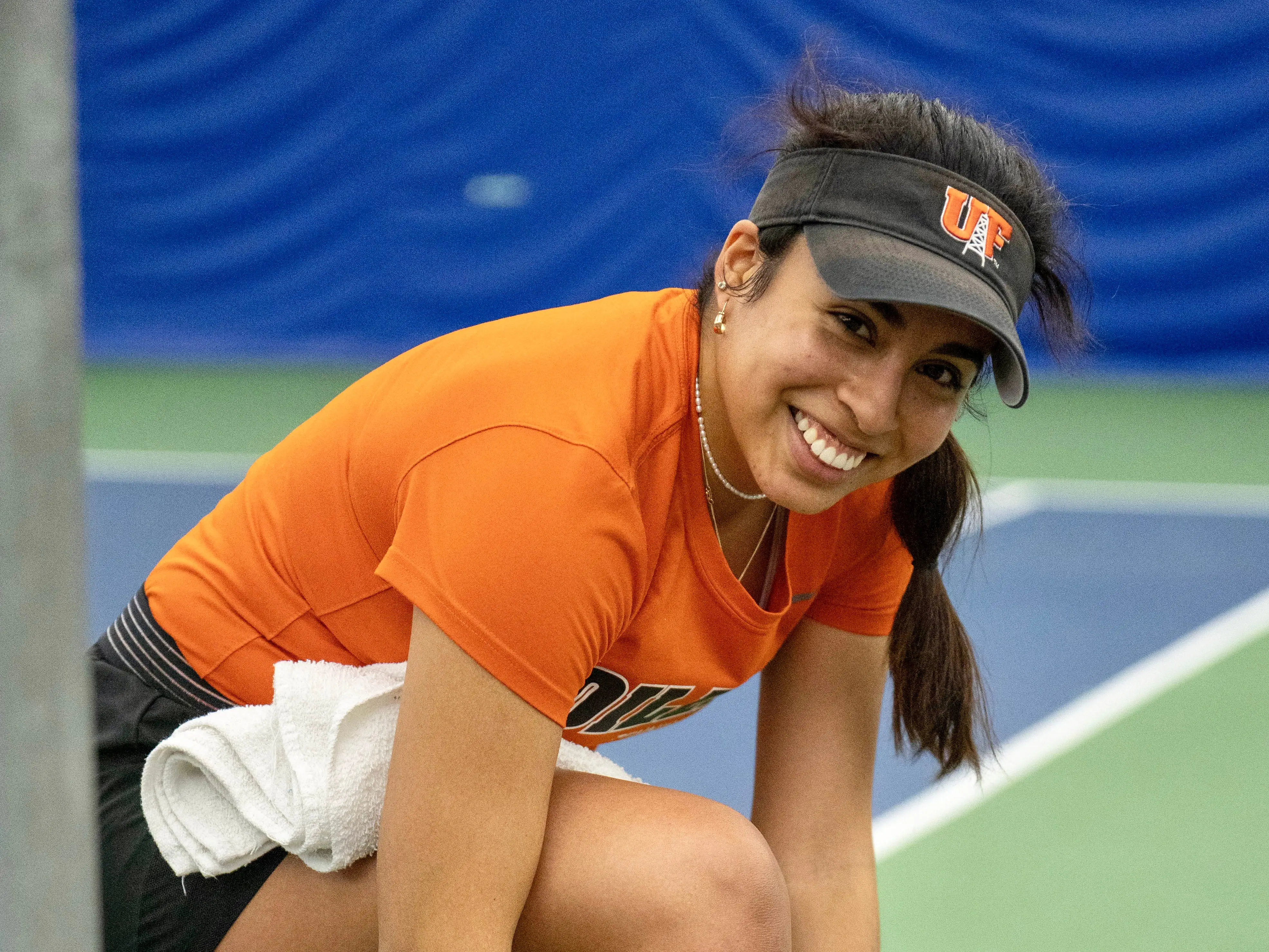 Luciana Pereyra on a tennis court.