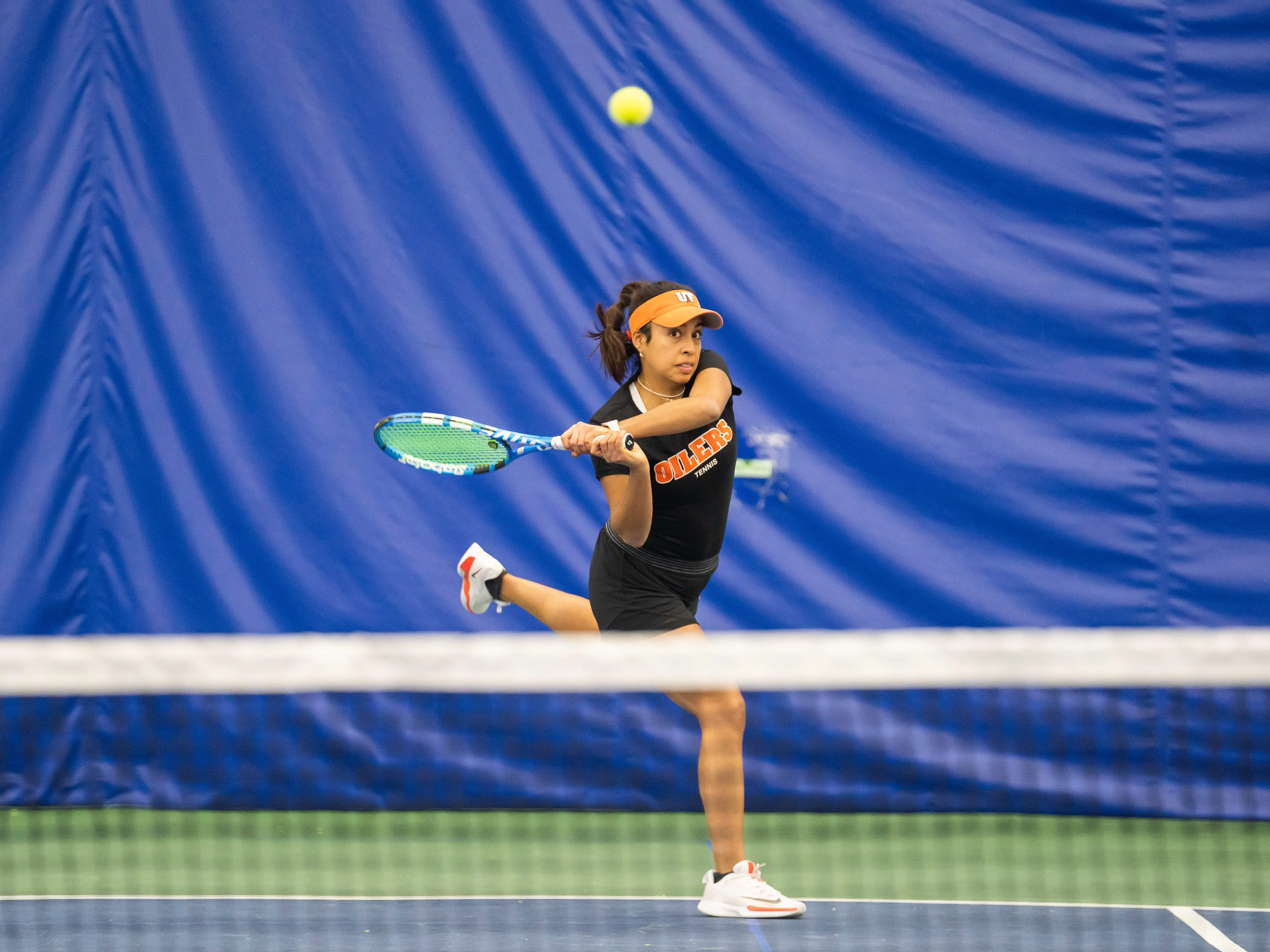 Playing varsity tennis at the University of Findlay.