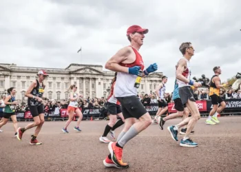 One runner spent $40,000, another took a second job. Marathoners are making big sacrifices to chase medals worldwide.