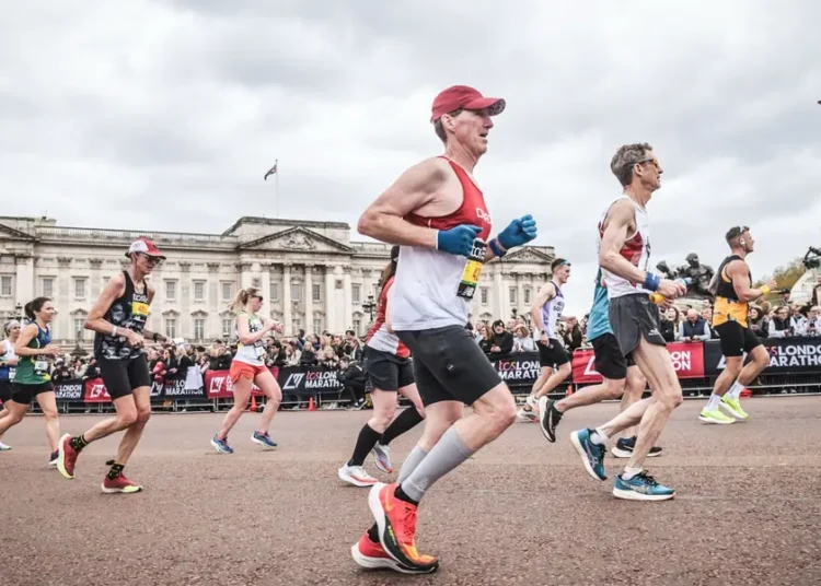 One runner spent $40,000, another took a second job. Marathoners are making big sacrifices to chase medals worldwide.