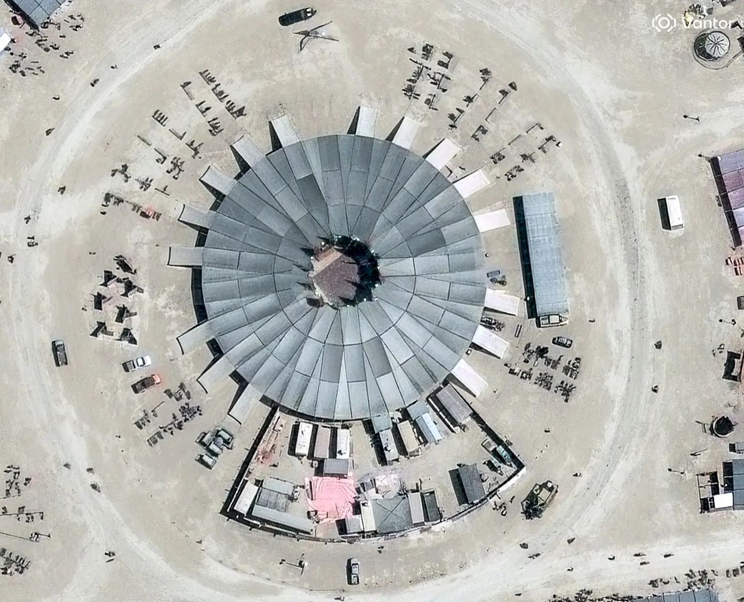 Vantor satellite image shows the city center at the Burning Man event with a circular central structure and surrounding tents and vehicles. Please use: Satellite image (c) 2026 Vantor.