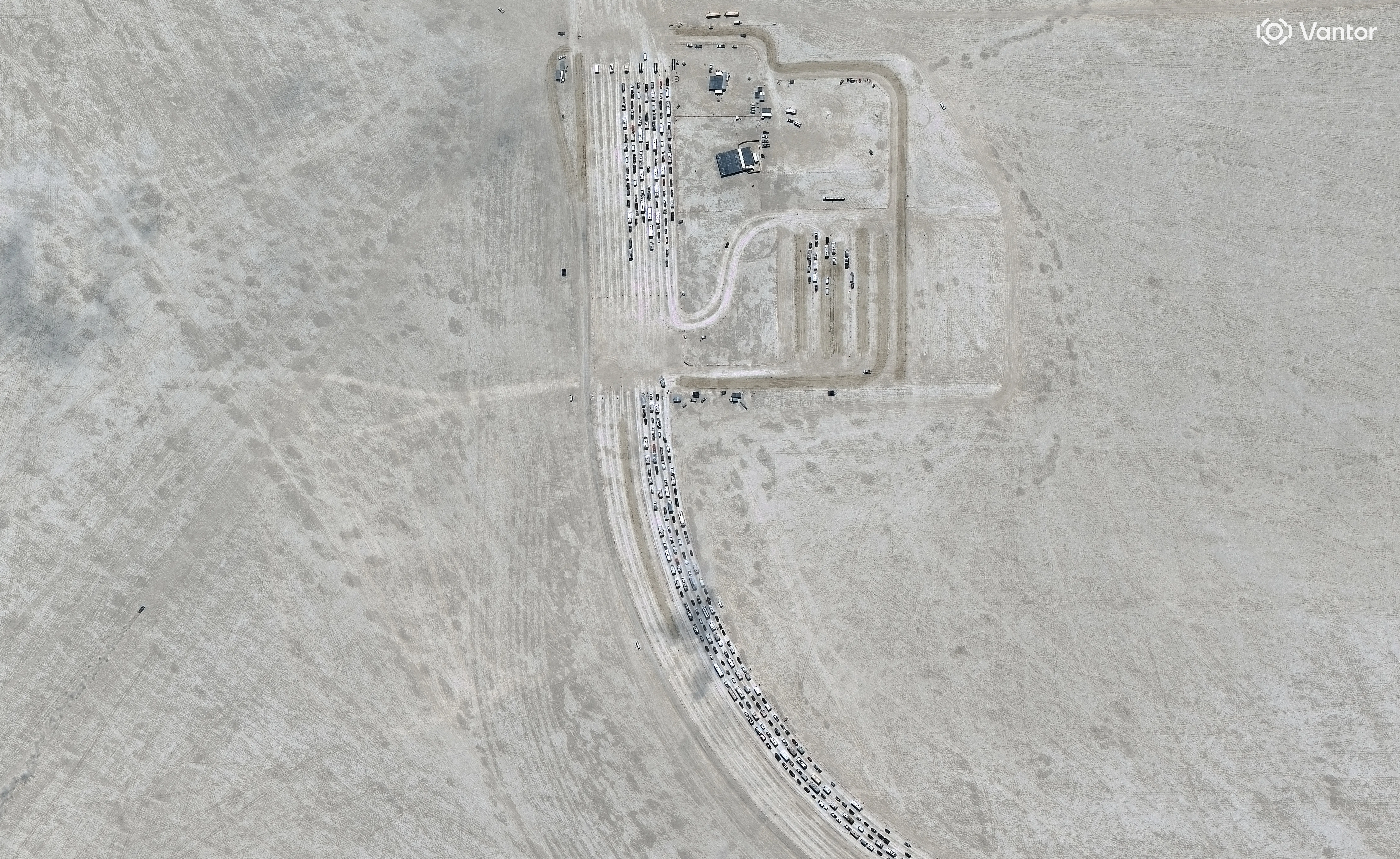 Vantor satellite image shows vehicles queuing to enter the Burning Man event at Black Rock City in Nevada. Please use: Satellite image (c) 2026 Vantor.