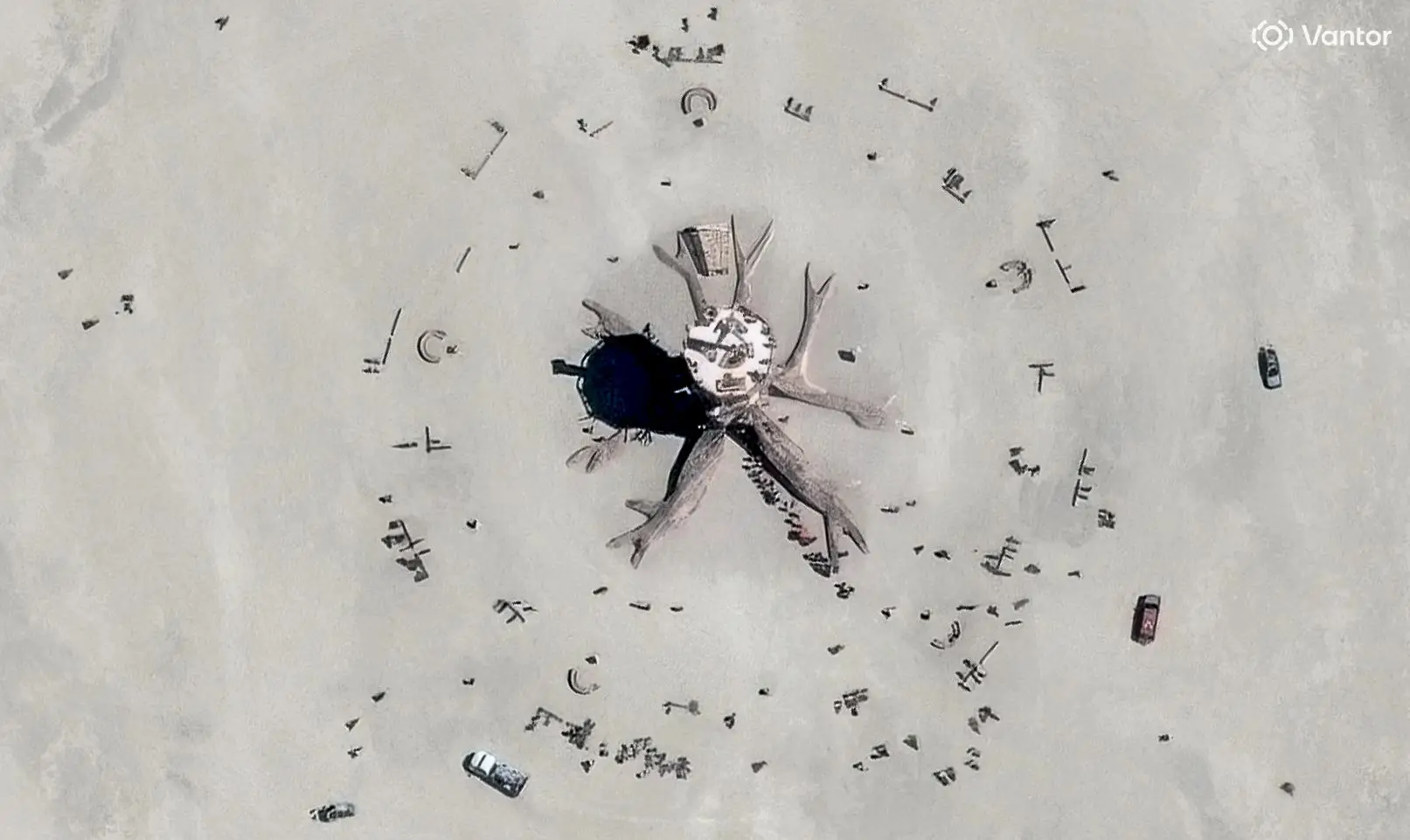 Vantor satellite image shows the Burning Man event's central structures and art installations in Black Rock City with gathering participants in the surrounding desert space. Please use: Satellite image (c) 2026 Vantor.
