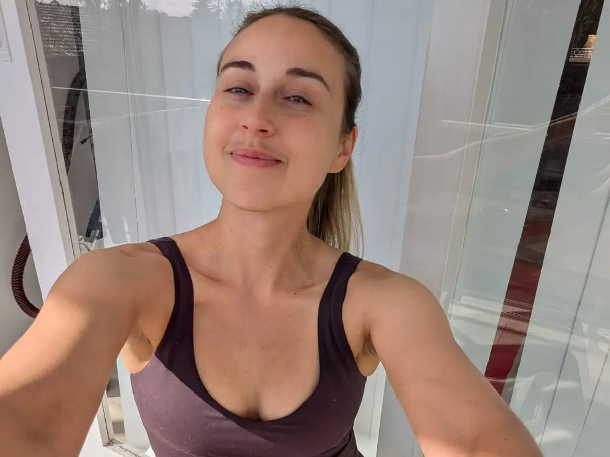 Woman taking selfie in workout clothes