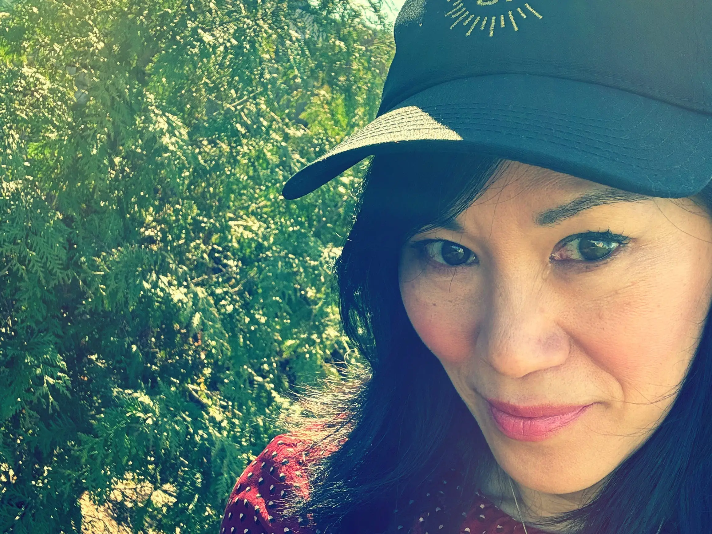 A woman wearing a baseball hat.