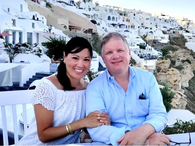 A couple sitting at a table on vacation