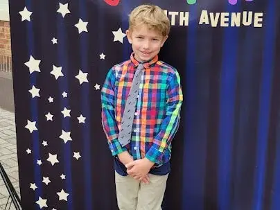 Boy posing for photo at school