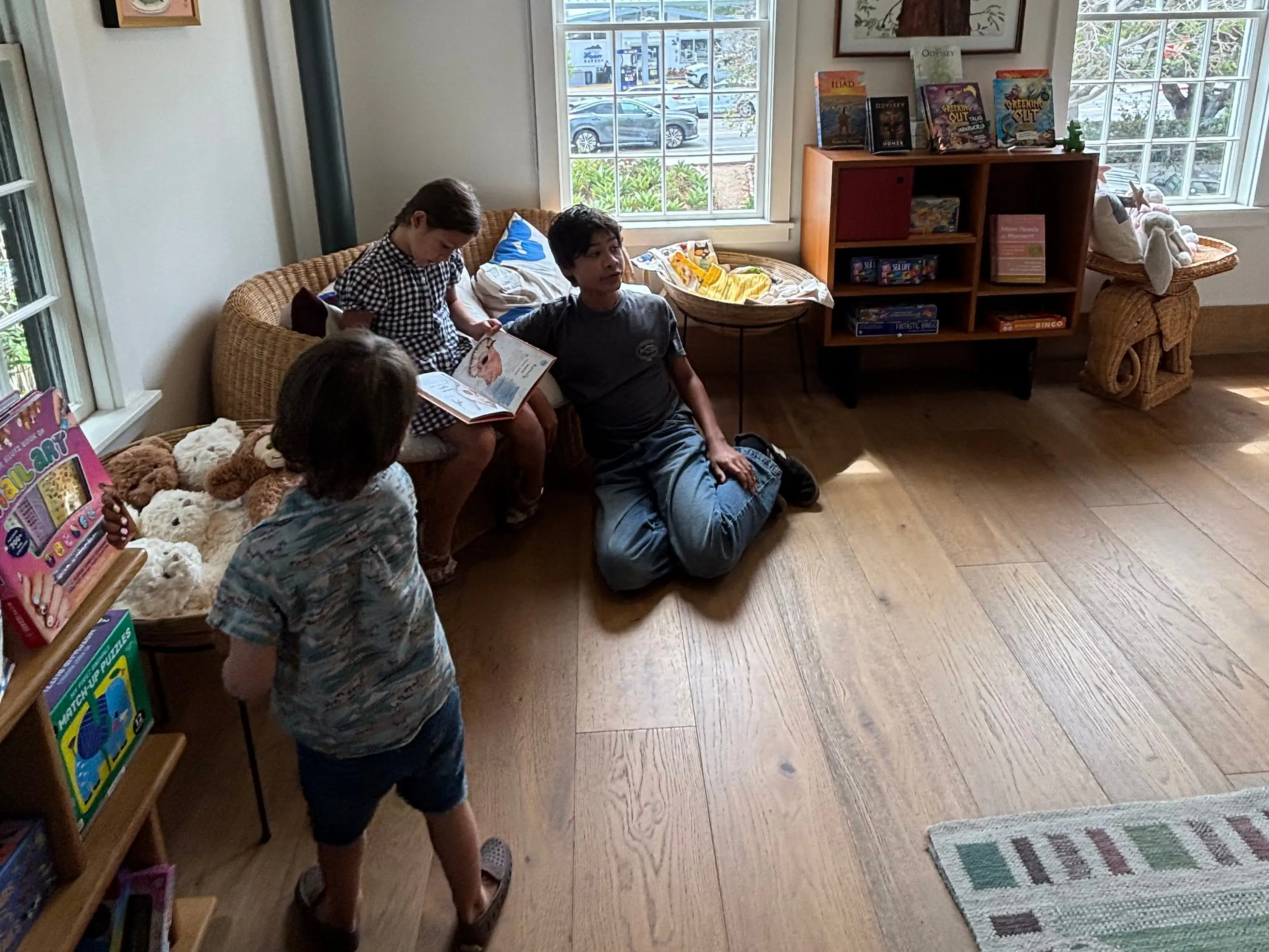 the author's kids reading at a bookstore