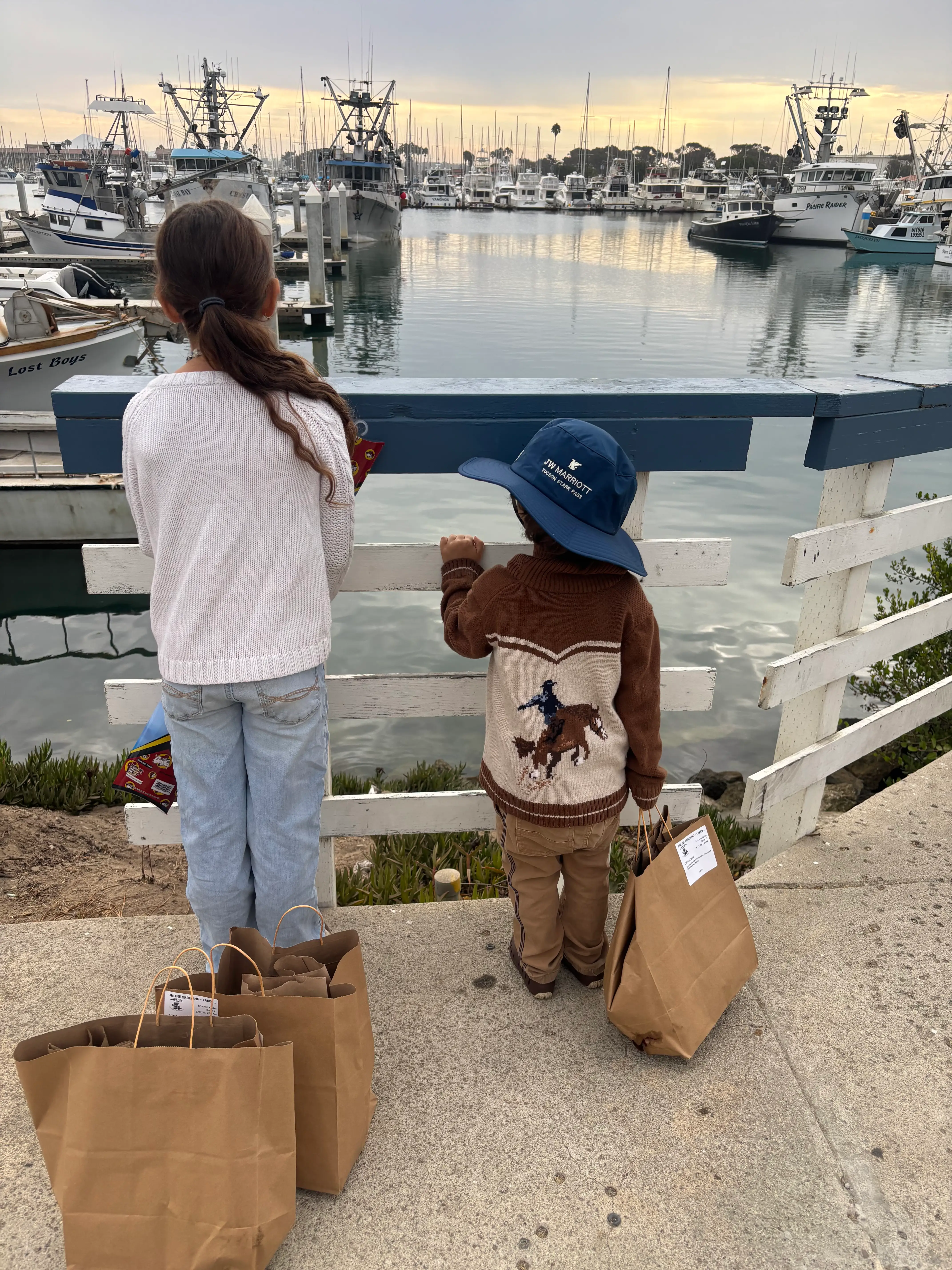 the author's kids on a pier overlooking the water