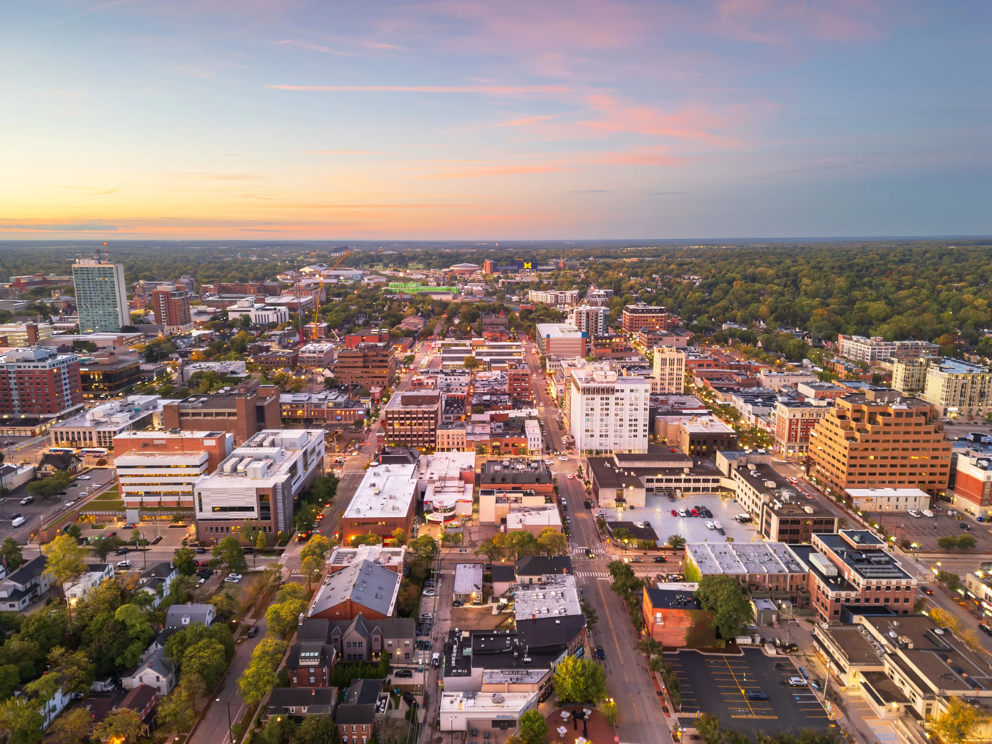 Ann Arbor, Michigan, USA college town skyline at dusk.