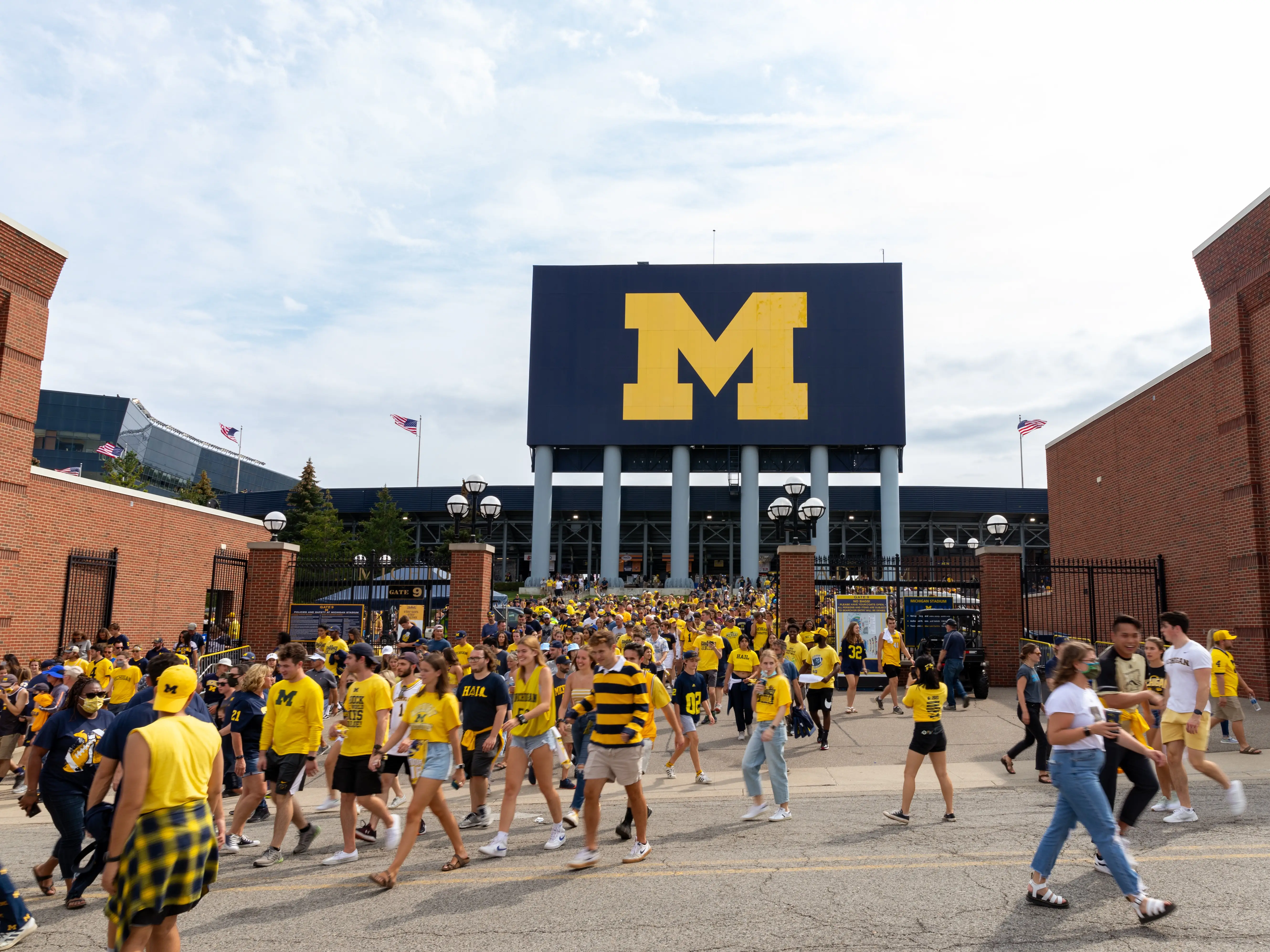 Unidentified Fans exit Michigan Stadium after a University of Michigan football game