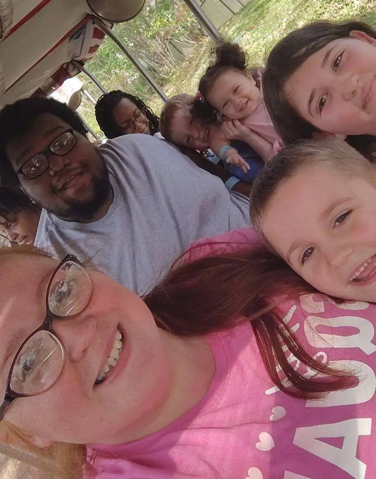 A family of eight taking a selfie.
