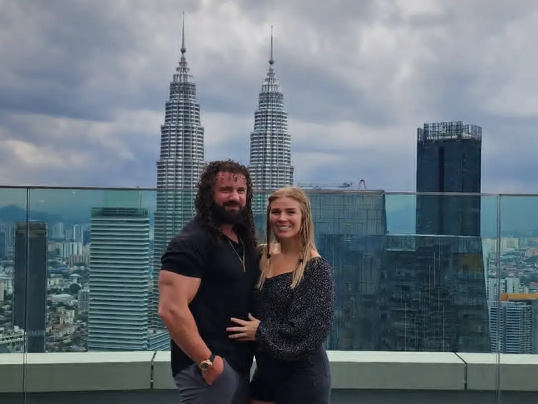 A couple posing for a photo in Malaysia.