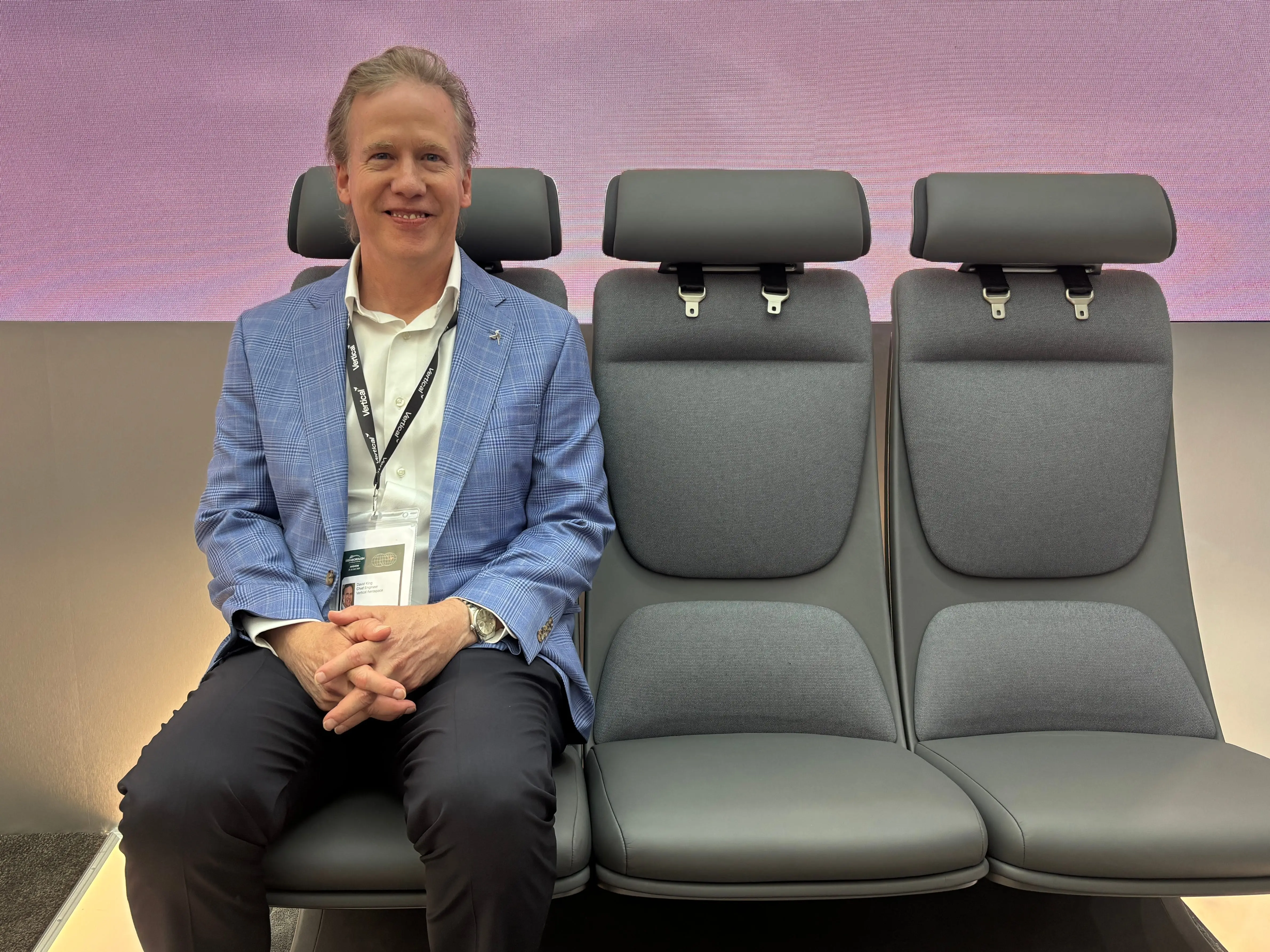 David King, the chief engineer of Vertical Aerospace, sitting on prototype air-taxi seats at the Farnborough Airshow 2026