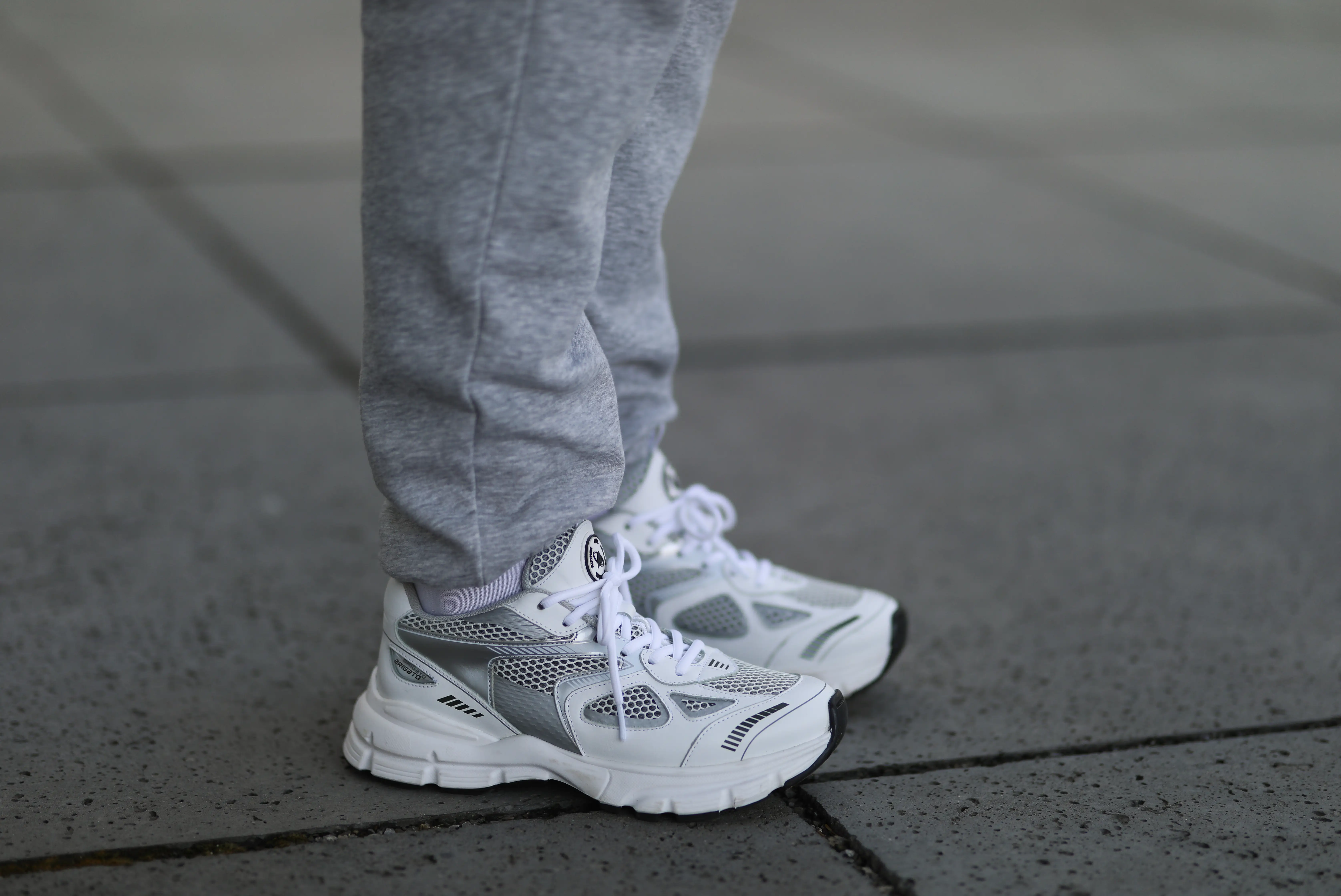 Chunky white and gray sneakers with sweatpants