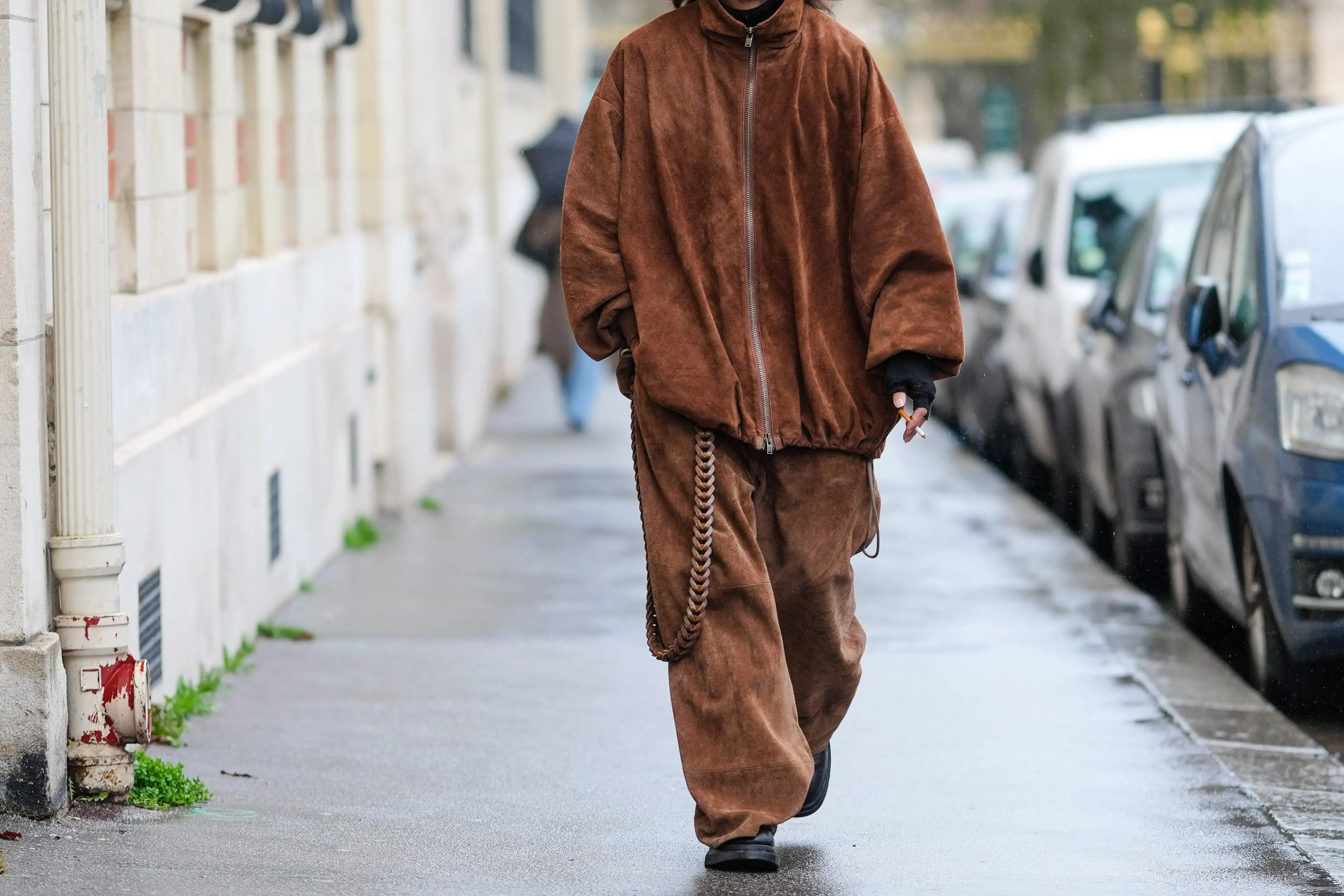 Person wearing baggy brown coat, baggy brown pants