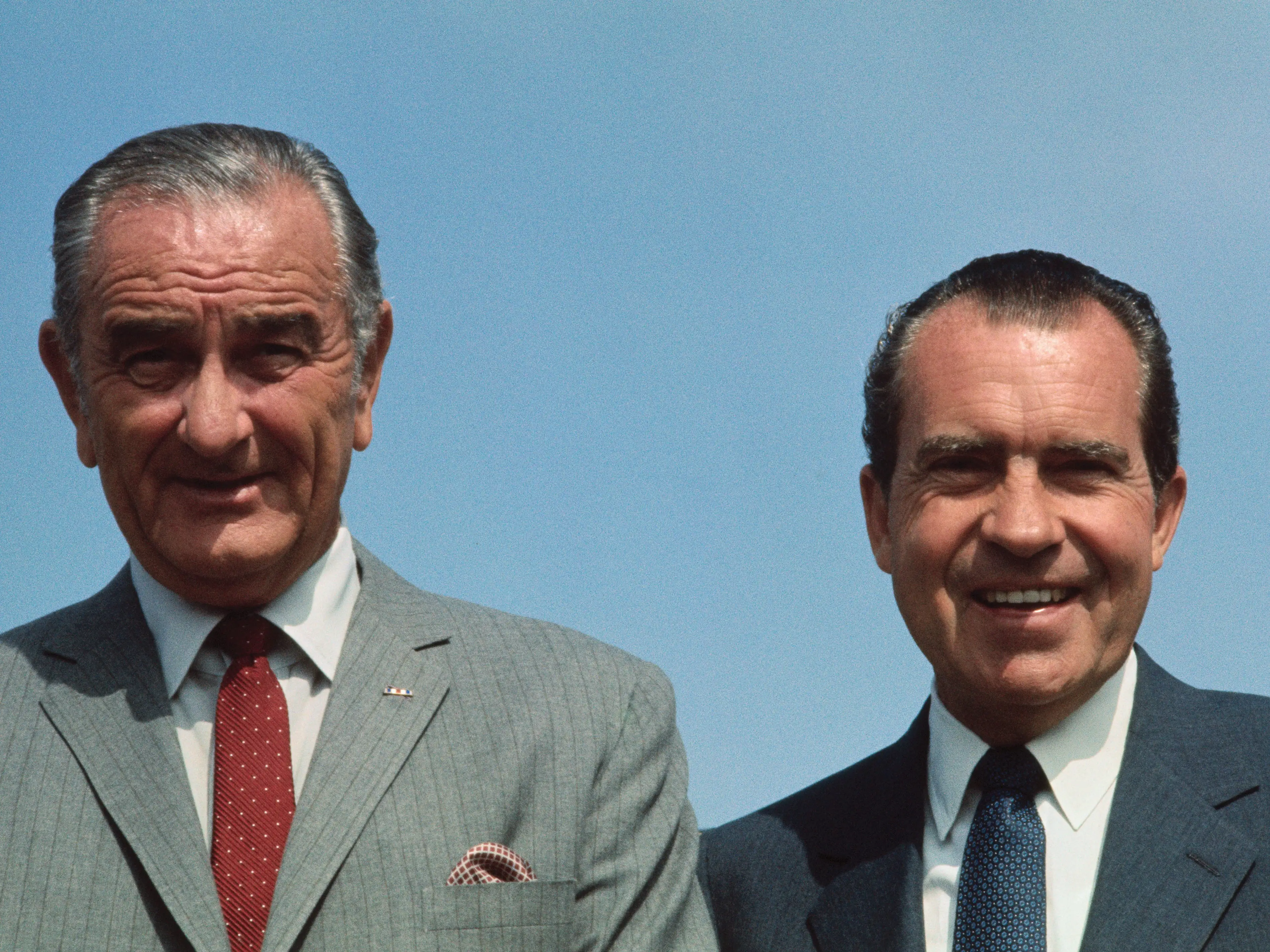President Richard Nixon greets former President Lyndon B. Johnson (left) at the White House here. President and Mrs. Nixon gave an informal luncheon honoring the former President on his 61st birthday.
