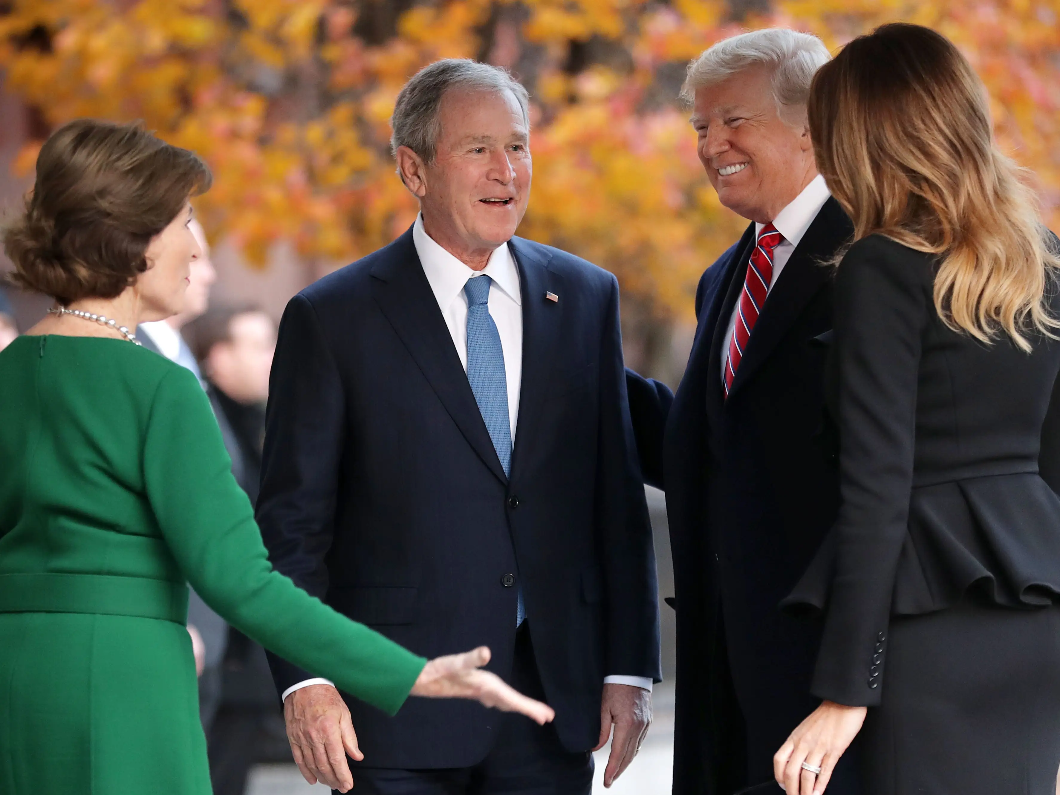 Former first lady Laura Bush and former President George W. Bush greet President Donald Trump and first lady Melania Trump outside of Blair House December 04, 2018 in Washington, DC.