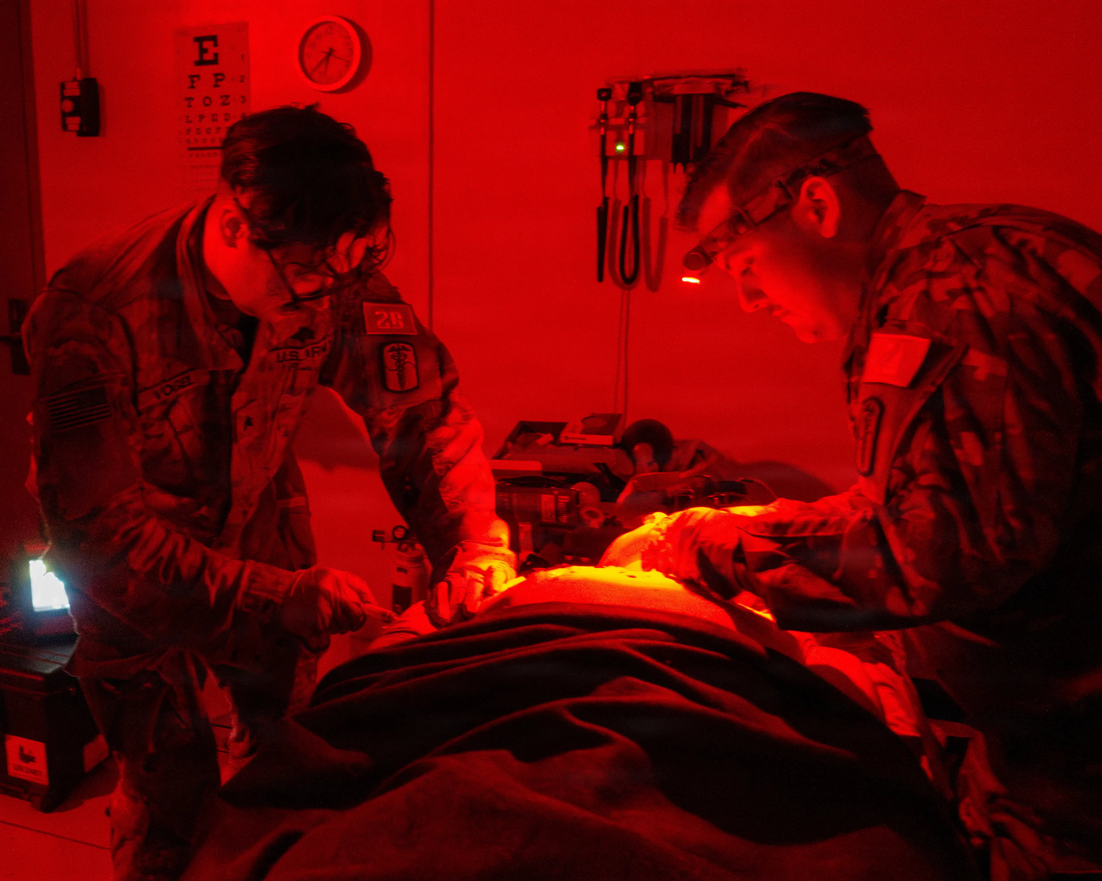 Army medics care for a simulated casualty in low-light conditions on Camp Humphreys, South Korea, Jan. 13, 2026.