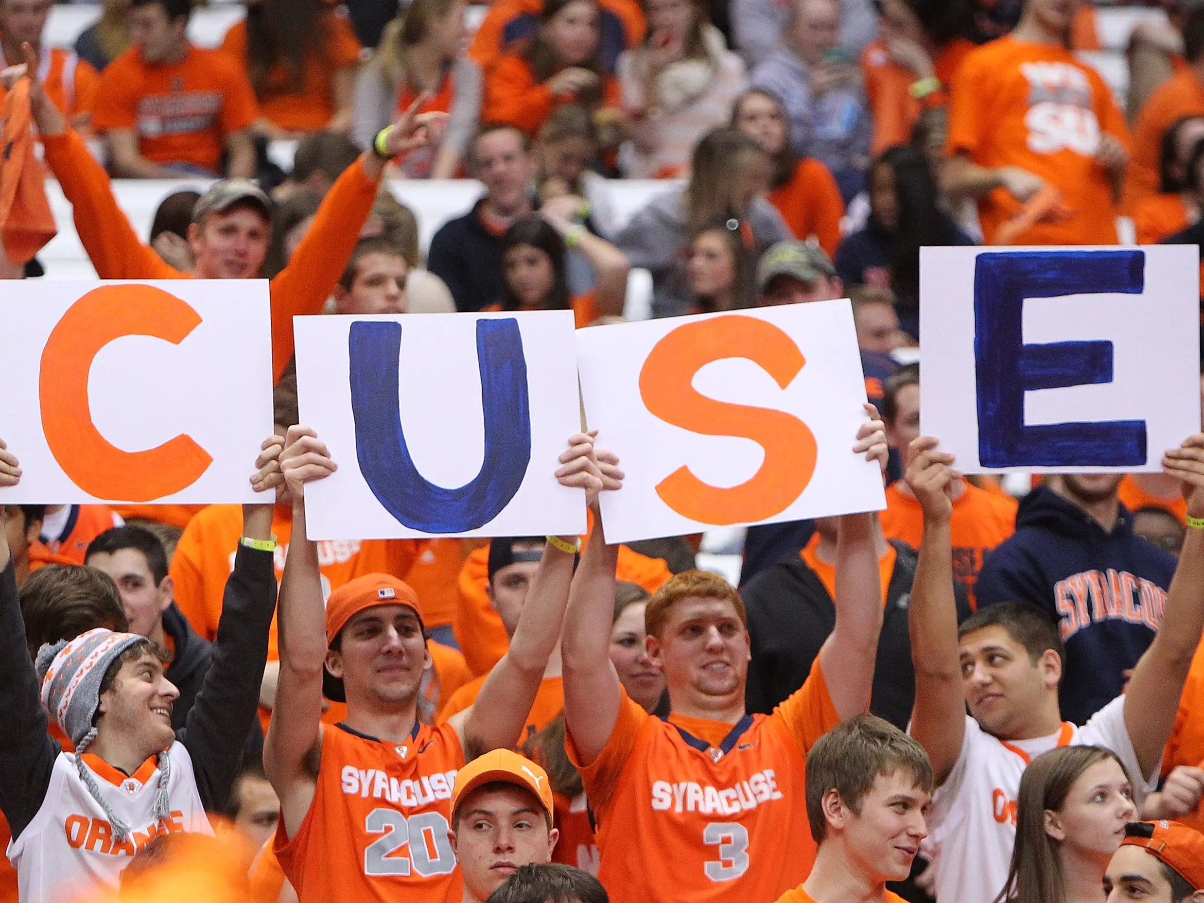 Fans of the Syracuse Orange are seen in the student section holding up posters spelling out 'CUSE' during the game against the Providence Friars at the Carrier Dome on February 20, 2013 in Syracuse, New York.