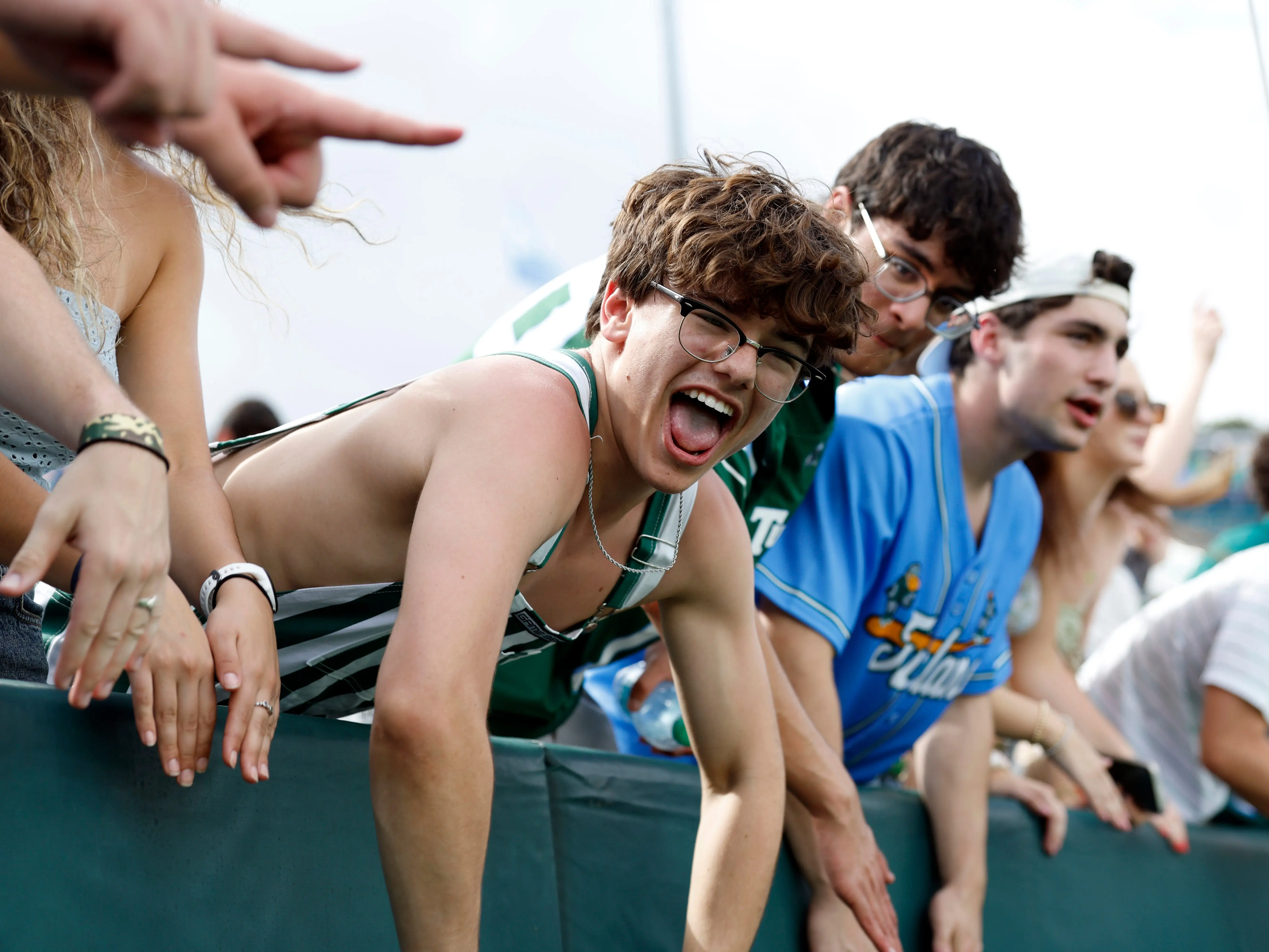 Tulane students cheer from the stands during the second half of a game between the Tulane Green Wave and the Army West Point Black Knights at Yulman Stadium on October 18, 2025 in New Orleans, Louisiana.