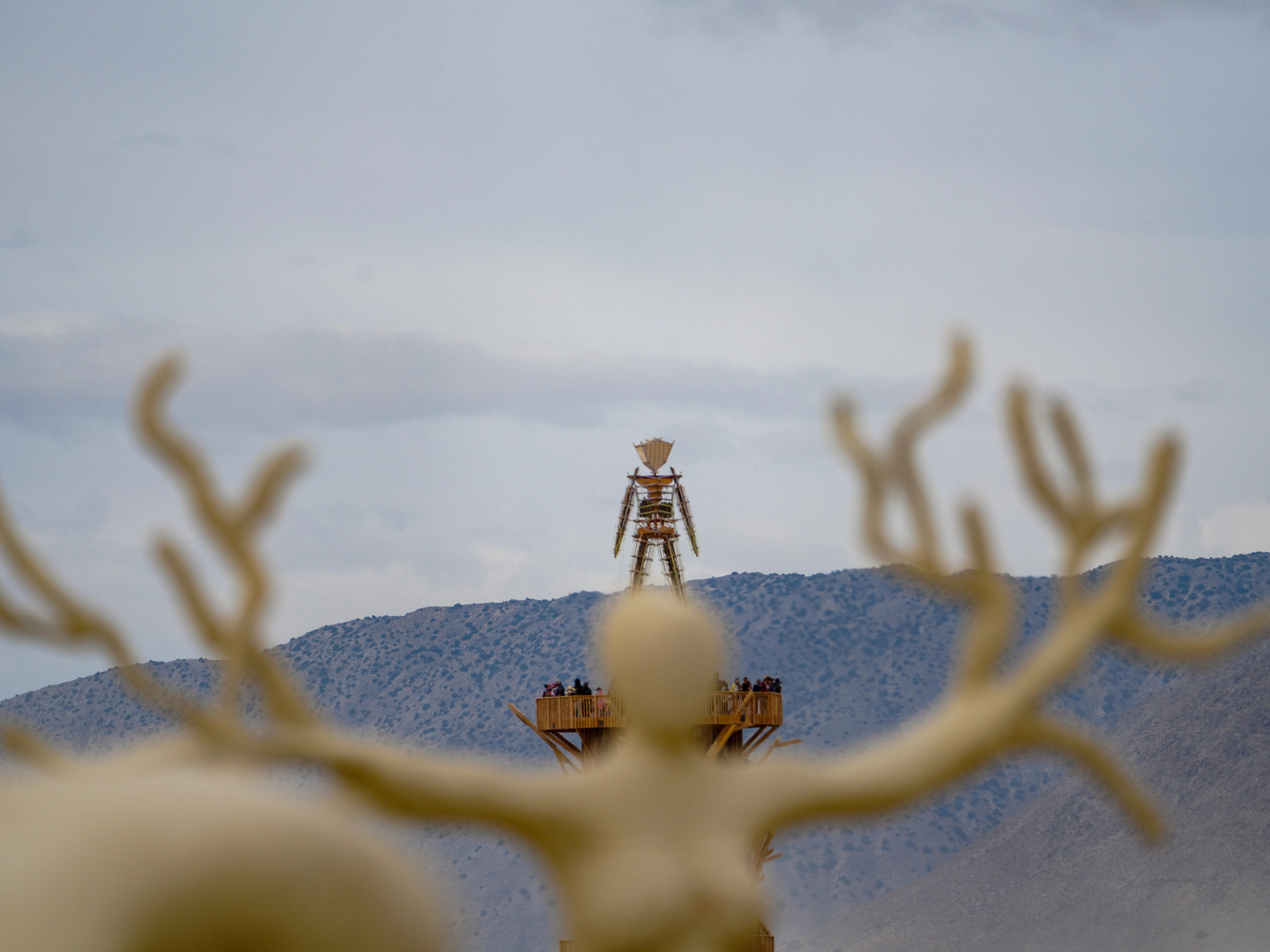 Burning Man 2026 attendees sample the art at Black Rock City during a dust storm on Sept. 2, 2026.