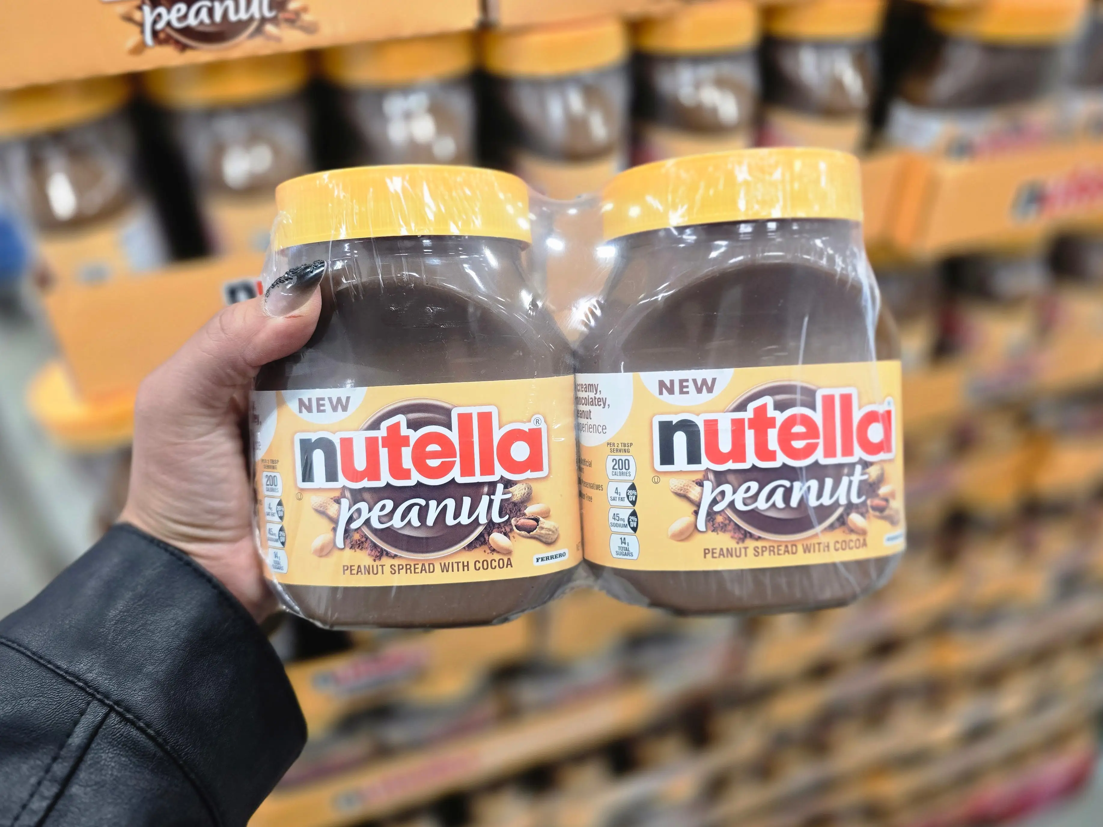Veronica holds a twin pack of peanut Nutella.