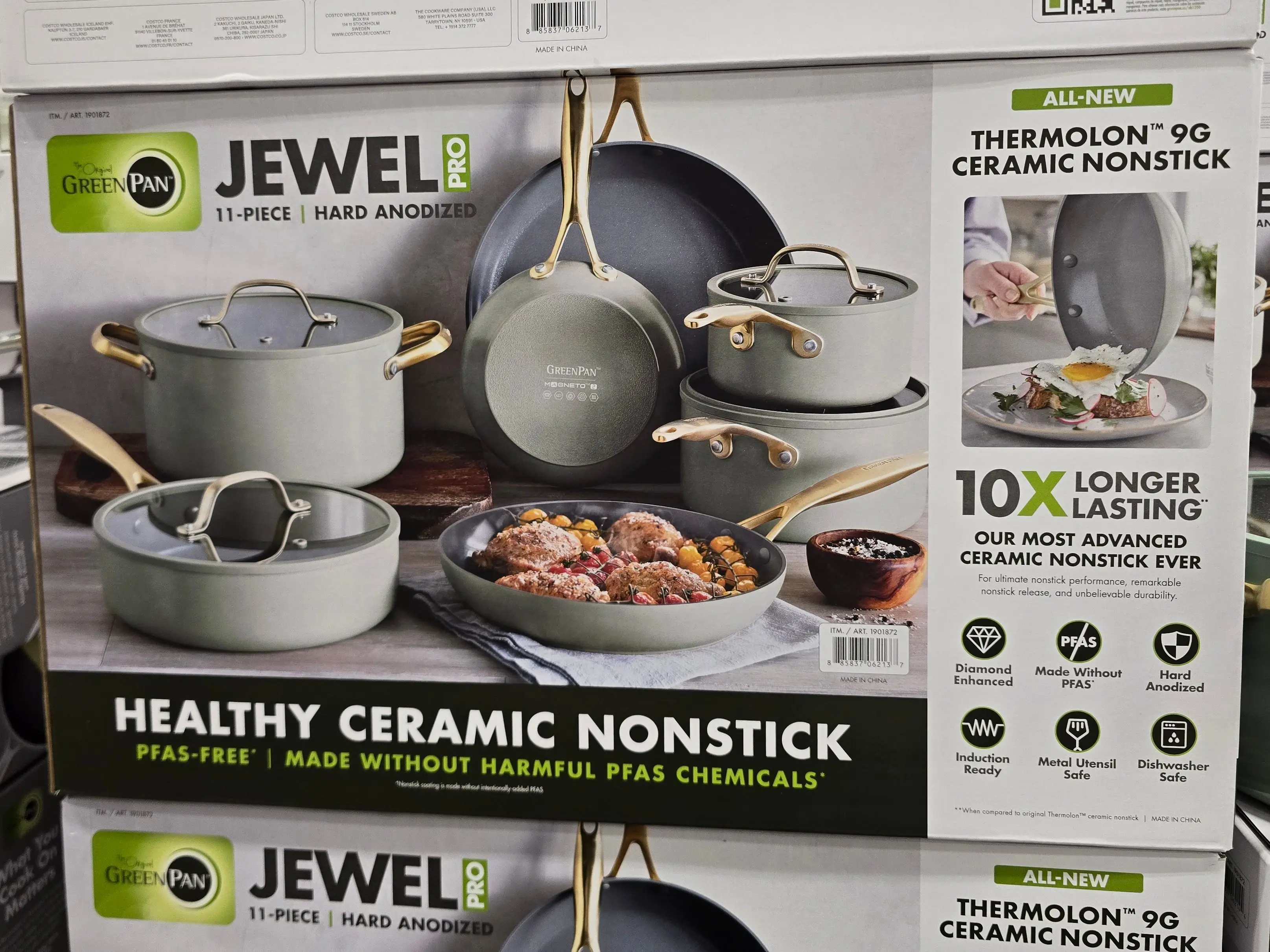 Boxes of GreenPan Jewel Pro 11-piece cookware sets on display at Costco.