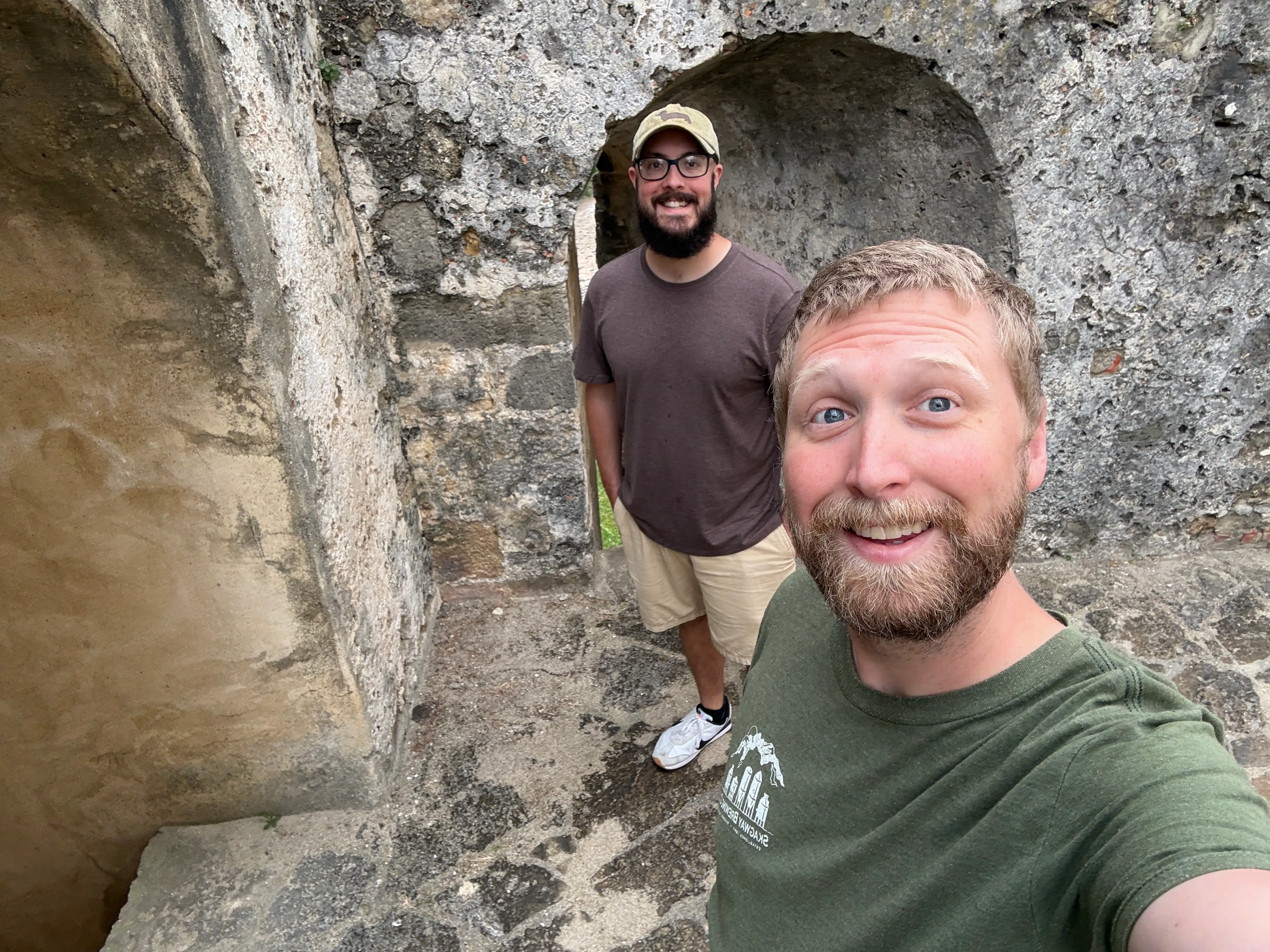Two men smiling at Lisbon's Sao Jorge Castle