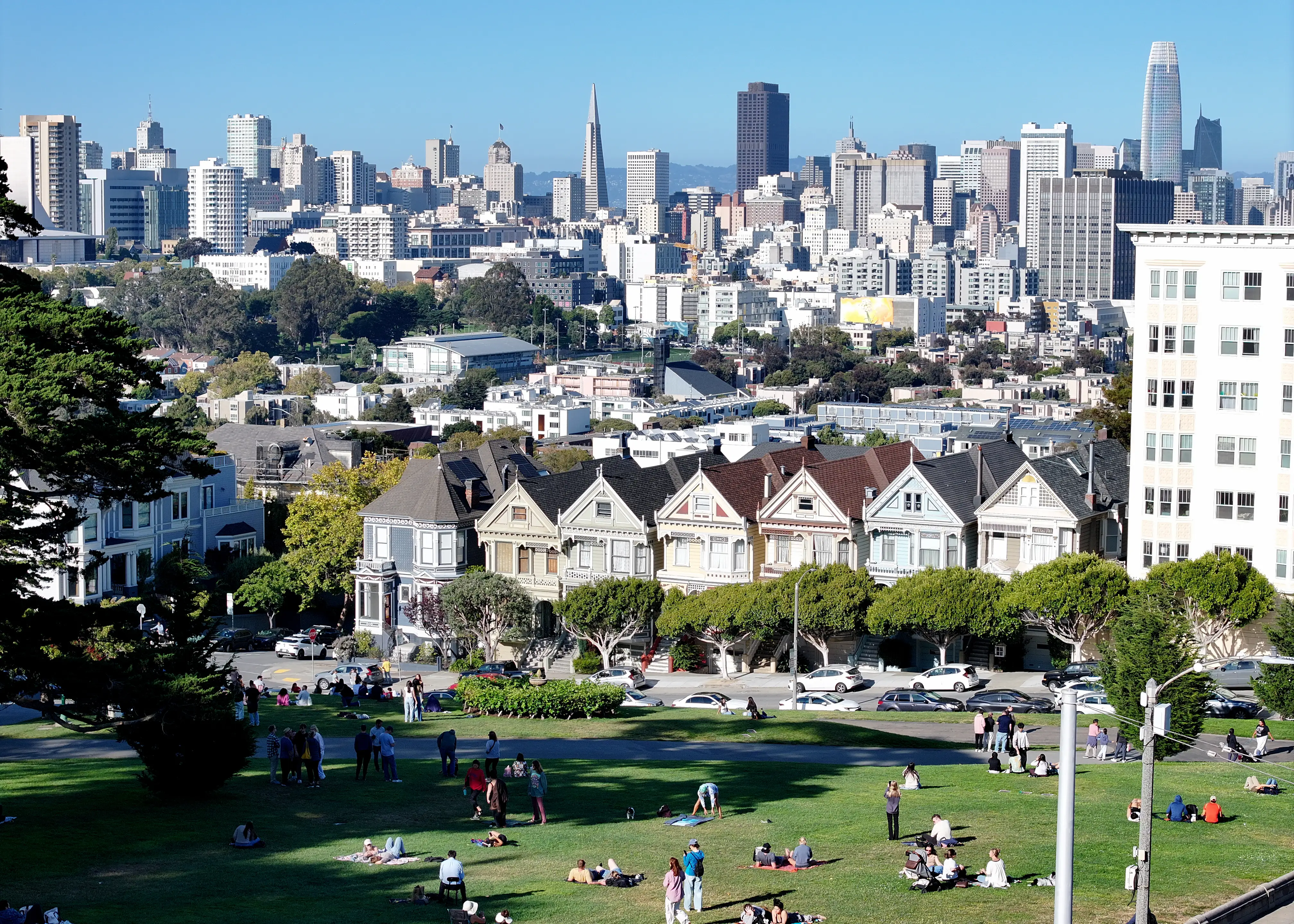 An aerial view of people enjoying warm weather at the Alamo Square Park next to 'Painted Ladies' in San Francisco, California, United States on August 6, 2026.