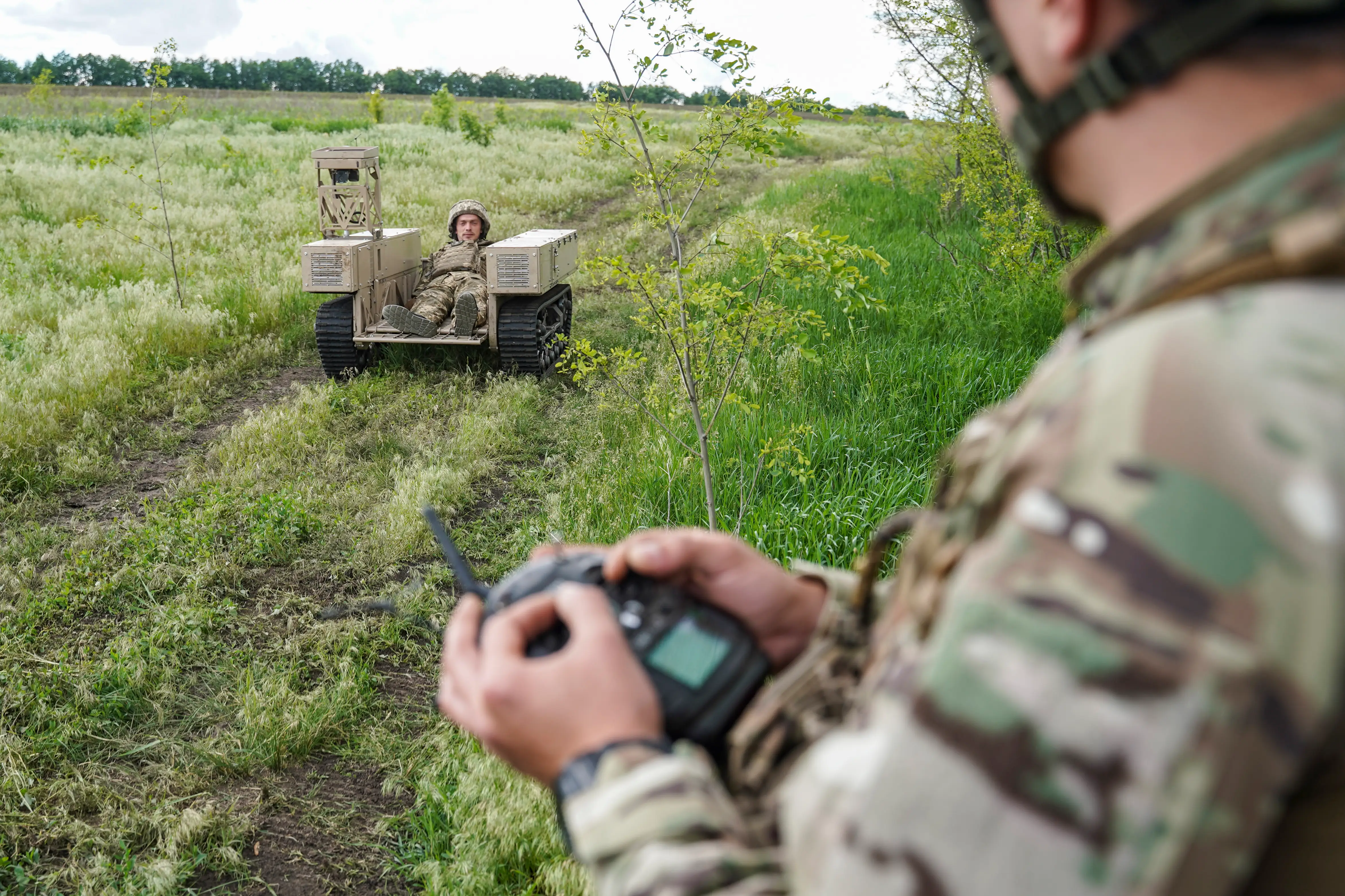 Ukrainian soldiers practice operating a ground-based drone (UGV) during a training session at the 10th Corps' drone school.