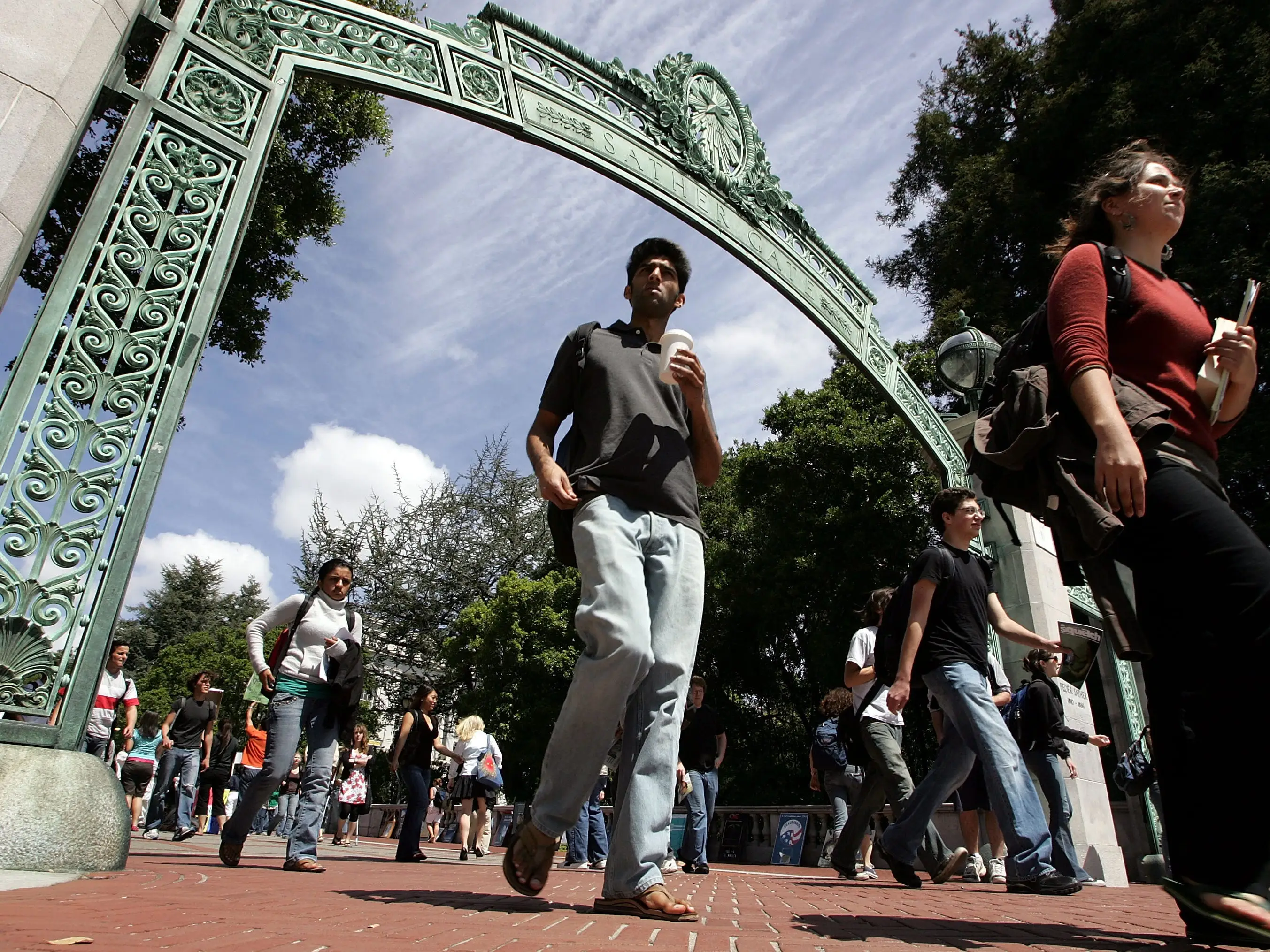 Students walk on a college campus.