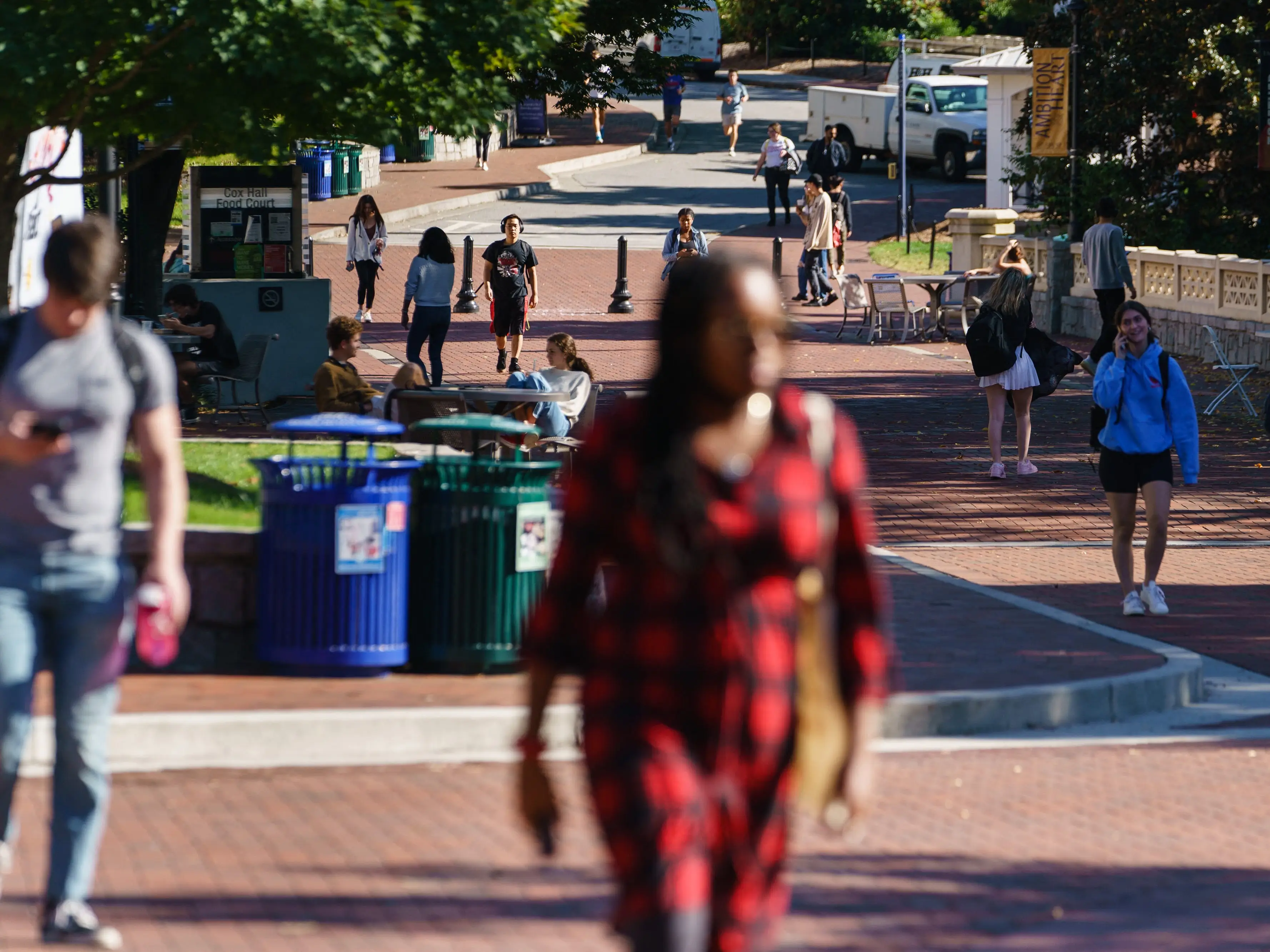 Students walk on a college campus.