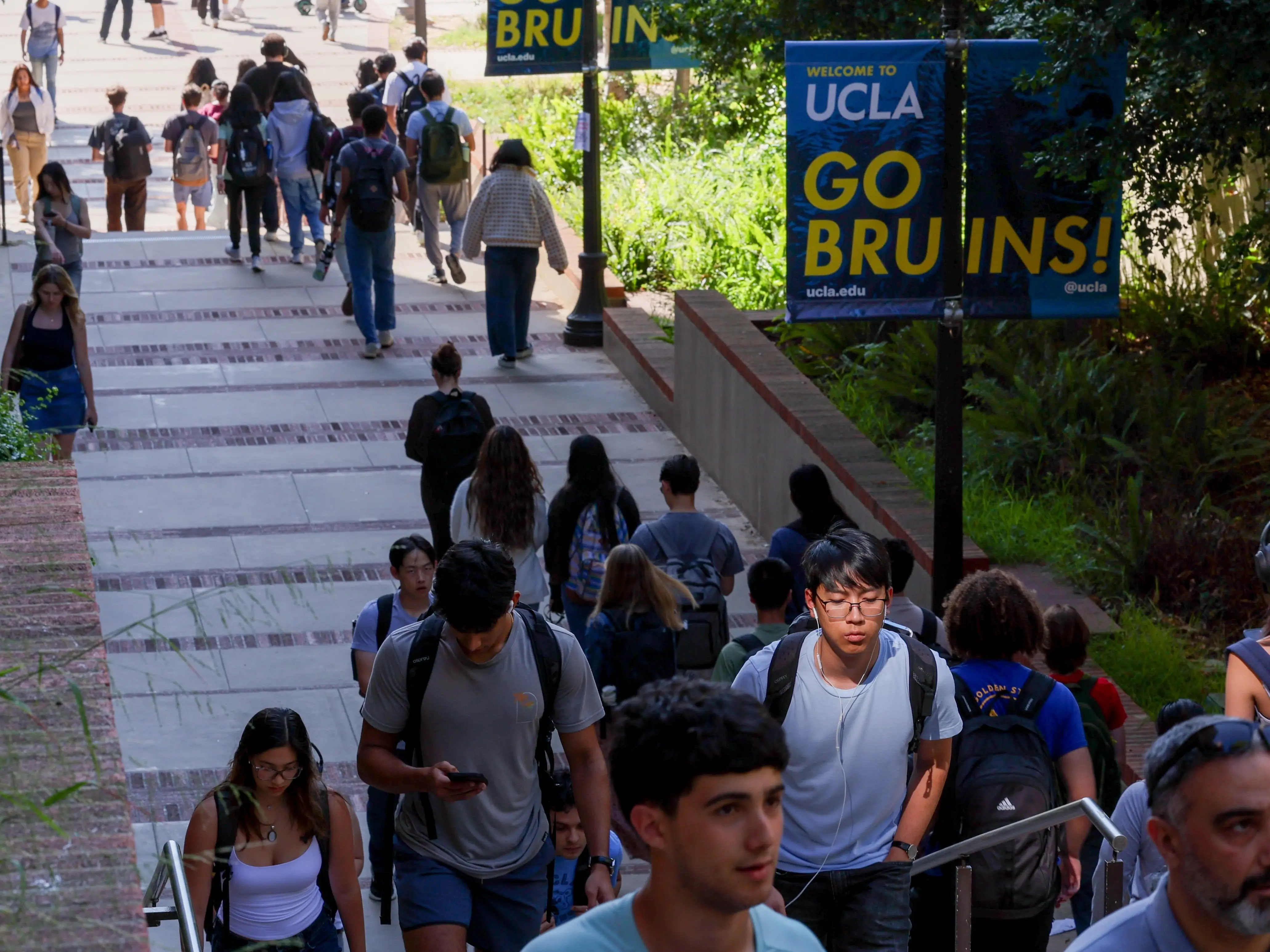 Students walk on a college campus.